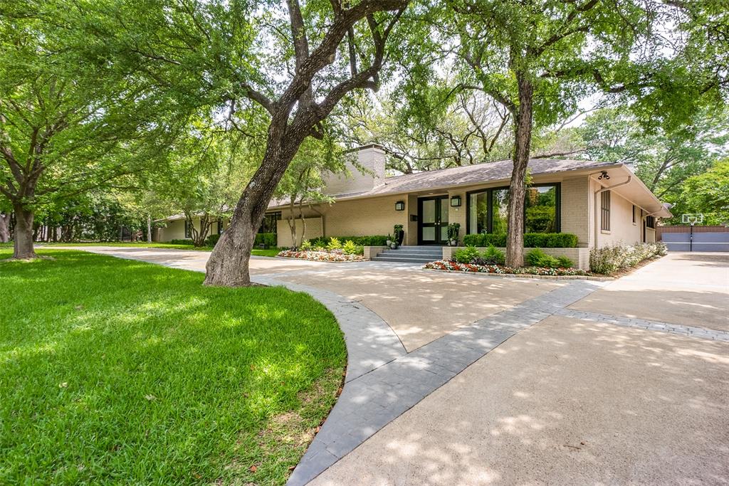 Sprawling and private, one-story retreat on .55 acr in tucked-away Sunnybrook Estates. Walls of glass offer natural light and panoramic views of the tranquil backyard. And with access from every part of the home, it’s perfect for entertaining at scale. The large, eat-in kitchen is well-equipped with high-end appliances, breakfast bar, and fireplace. The layout is very versatile and each of 5 bedrms has an updated en-suite bath. Some highlights include abundant built-in storage and bookshelves, air-conditioned art room, wet bar, pool, firepit, built-in grill, and separate backyard play space. Ideally situated between Inwood and Midway with easy access to premium retail, Tollroad, Love Field, and Central Market.