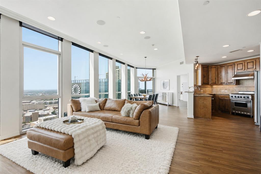 Welcome to Residence 3010 at The Tower, where breathtaking views and sophisticated urban living come together in the heart of downtown Fort Worth. From the moment you step through the front door, the first impression is simply Wow! Floor to ceiling windows frame spectacular skyline views that immediately capture your attention.

This spacious, open concept floor plan is designed for both comfortable everyday living and effortless entertaining. The living, dining, and kitchen areas flow seamlessly together, all positioned to maximize the incredible views. The luxurious primary suite offers a peaceful retreat with a large walk-in closet and an elegant ensuite bath featuring dual vanities, a soaking tub, and separate shower.

The thoughtfully designed split-bedroom layout provides privacy for both residents and guests. The secondary bedroom includes its own ensuite bath, creating a comfortable and private guest suite. A dedicated office with builtin desk provides the perfect work-from-home space, while the bonus room with integrated audio speakers offers endless possibilities as a media room, theater, game room, or flexible living space.
Residents of The Tower enjoy premier high-rise amenities including 24 hour concierge service, a resort style outdoor pool and spa deck, fitness center, party room, guest suites, dog park, and a dining terrace with gas grills.
Ideally located in the center of downtown Fort Worth, The Tower places you just blocks from Sundance Square, world-class dining, entertainment, business centers, and cultural attractions. Miles of scenic Trinity River trails are just steps from your door. With an exceptional Walk Score of 94, this premier highrise community offers the ultimate lock-and-leave lifestyle in the center of everything Fort Worth has to offer.