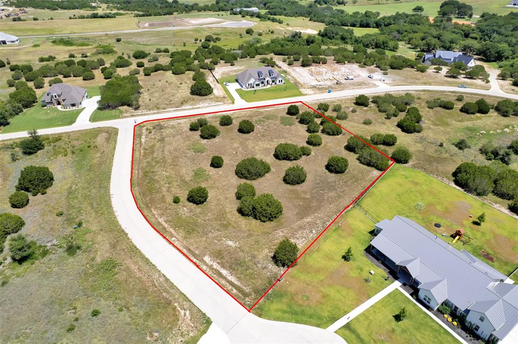 Welcome to Putteet Hill, an exclusive gated community in Cresson where expansive 2+ acre homesites, paved concrete streets, and peaceful countryside living come together beautifully. Residents enjoy a private, stocked lake—perfect for quiet mornings of fishing or unwinding at sunset—while still being conveniently close to everything you need, including just 5 miles to HEB, 2 miles to the Cresson Bypass, 17 miles to I-20, and only 9 miles to the charm of historic Granbury Square.

301 Elliott Ct presents a prime opportunity to build your custom dream home, place a manufactured home, or secure a smart investment in a rapidly growing area. With easy access to US-377 and the Chisholm Trail Parkway, commuting to Fort Worth, Granbury, or Weatherford is effortless. Offering wide-open skies, gently rolling land, and a true sense of space and privacy, this property delivers the perfect balance of serenity, flexibility, and long-term potential in one of North Texas’ most desirable hidden gems.