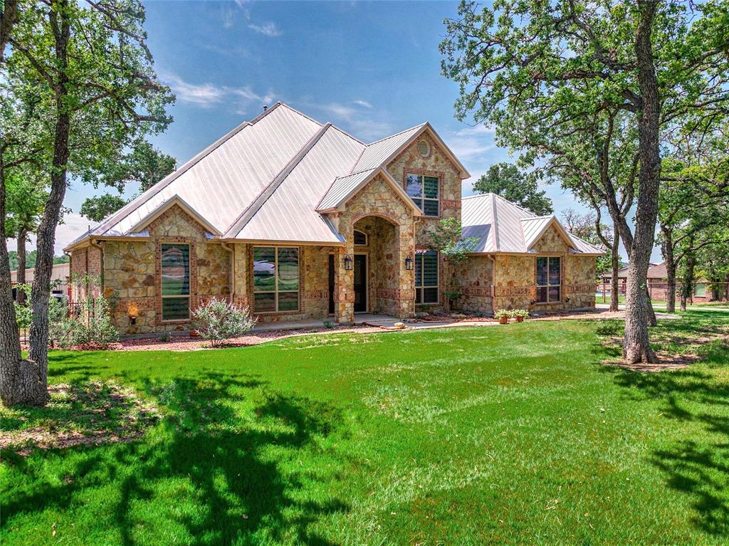 FULLY FURNISHED and turnkey, this exceptional Silverado on the Brazos estate delivers the ideal blend of luxury living, equestrian functionality, and resort-style amenities on 4.889 beautifully maintained acres with private Brazos River access.
The updated two-story residence features 4 bedrooms, 3 bathrooms, a dedicated office, and spacious living areas designed for both everyday comfort and entertaining. A formal dining space opens into the main living room, where a dramatic stone feature wall and modern electric fireplace create a warm and inviting atmosphere. Recent improvements include updated quartzite countertops, fresh interior paint on walls and cabinets, upgraded lighting, and more extensive updates throughout the home and barn.
The outdoor living space is designed to impress, featuring a sparkling pool with a waterfall feature, shaded patio areas, and peaceful country views perfect for relaxing or hosting guests.
Equestrian facilities are second to none with a 36’ x 114’ custom barn featuring three Classic Equine European-style 12x12 stalls with stall mattresses, automatic waterers, fans, cameras, and covered runs, plus two additional covered exterior stalls. The barn also includes custom rubber pavers, tack and feed rooms, a workshop space, extensive covered trailer and equipment parking, and a newly completed guest quarters with a full bath.
Additional property highlights include freshly painted and spray-foam insulated barn, shop, and apartment spaces, a new 24’ x 10’ loafing shed, four paddocks, round pen, custom pipe fencing, and two covered RV hookups with both 30-amp and 50-amp service.
This property offers comfort, functionality, and move-in-ready convenience in one of the area’s most sought-after equestrian communities. Furnishings convey with the property. See agent for exclusions.