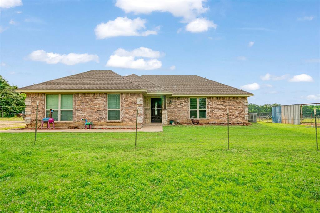 Hard to find country living. So peaceful. Come make it your own.  3 Bedroom 2 Bath brick home sitting on 2 acres. It has stained concrete flooring throughout the house. Built in 2016. Covered porches with a 32×45 barn with stalls, feed room and lean to that could be converted into a nice shop. Crossed fenced for a small farm!! This one doesn't disappoint.