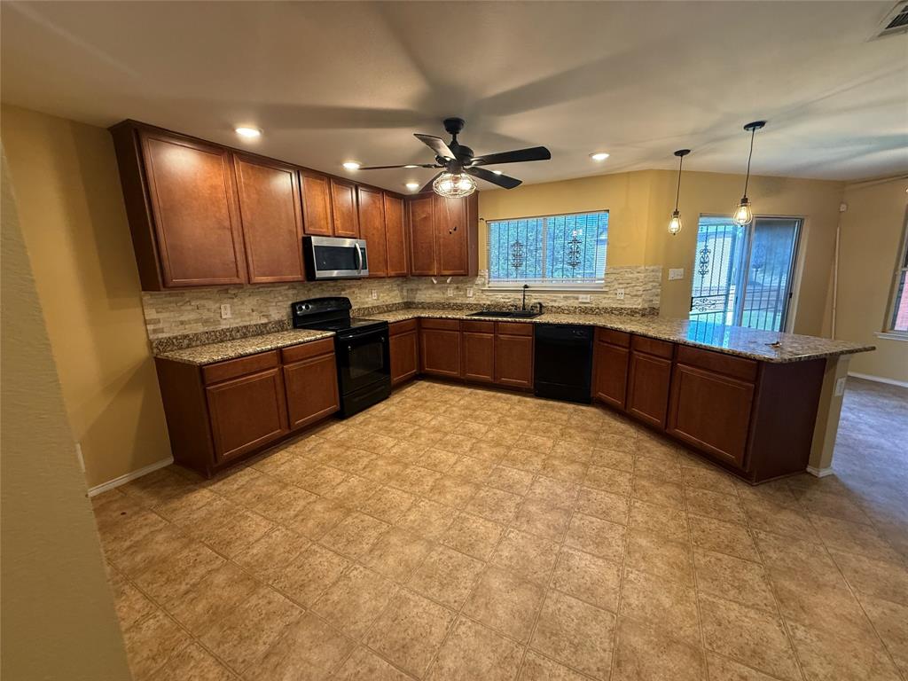 Rare find in this Conveniently located Neighborhood! Tons of space in this updated two story home on large lot with storage building.  Floorplan is open concept living with big kitchen, featuring granite counters, plenty of cabinets and windows overlooking covered patio and large backyard.  The second living downstairs is perfect for a game room or large study!  Upstairs has a huge primary bedroom with sitting area, Two nice size secondary bedrooms plus a third living area for child's playroom or TV room! Don't miss this opportunity to own your own Home with lots of room!