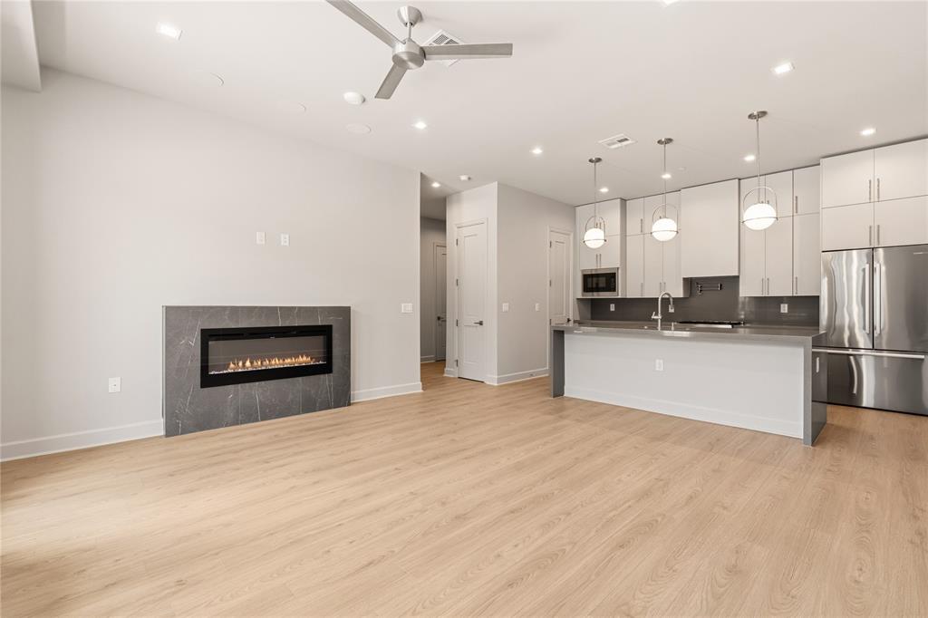 *Ask about Buyer Incentives, including a 2-1 buydown with the Preferred Lender, and $5k toward buyer closing costs!*

Welcome to Unit 311 at 1900 S Ervay “The Ruston,” a newly completed new-construction residence offering panoramic Downtown Dallas skyline views and refined modern living on the edge of the city’s urban core. This exclusive condominium building sets the standard for sophisticated living, combining striking architecture with world-class amenities in the heart of the vibrant Cedars neighborhood, just minutes from premier dining, shopping, entertainment, and cultural attractions. This architectural masterpiece features 58 luxury condominium residences, each meticulously crafted with premium materials and thoughtful design Residents enjoy access to a full suite of resort-style amenities, including a community reflection pool, state-of-the-art fitness center, media room, wine room, game room, clubhouse, conference room, dog run with dog-washing station, pickleball court, putting green, and an outdoor lounge with grilling areas, ideal for entertaining or unwinding in style. 

Unit 311 offers 1,430 square feet, featuring 2 bedrooms and 2.5 bathrooms, with expansive windows and a private balcony that flood the home with natural light. The open-concept interior showcases high ceilings, designer fixtures, and upscale finishes, highlighted by a chef’s kitchen with a 6-burner Bertazzoni gas range, Bosch refrigerator, wine cooler, pot filler, under-cabinet lighting, and soft-close cabinetry. Built-in surround sound speakers, an electric fireplace, enhance both comfort and functionality.