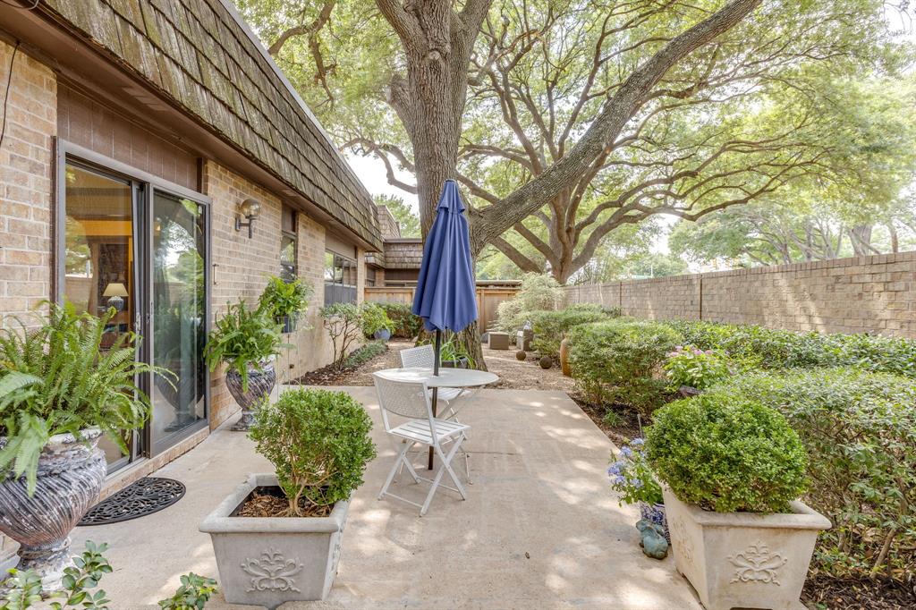 Incredible townhome in one of Fort Worth's most beloved and coveted neighborhoods!  Zoned to the exemplary Tanglewood Elementary and steps from the Tanglewood walking trails, tennis courts and a .5 mile from Trader Joe's and amazing shopping and dining options!  This one level 2 bed 2 bath townhome with a cozy breakfast space,  formal dining area and a 2 car garage in this highly sought after community is warm and inviting and has been lovingly cared for!  Move in ready while maintaining some original character giving buyers options on continued updates.  Inside you have soaring ceilings in the living space that features a wood burning fireplace and sliding glass doors that open to the gorgeous patio with established landscaping and large trees making morning quiet time or evenings hosting friends a given!  Did we mention the cool feature of having a wet bar in the living room?  Entertaining made easy inside or out, you are going to want to see this one.  Washer Dryer and Refrigerator will convey.