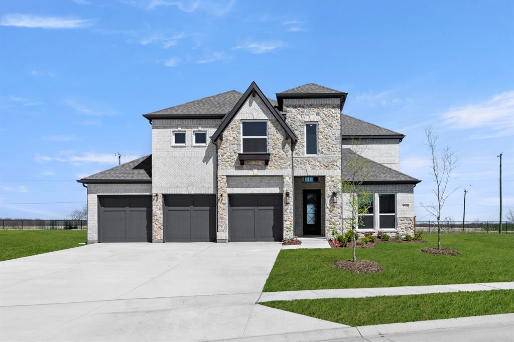 MLS# 21109283 - Built by First Texas Homes - Ready Now! ~ This stunning two-story luxury home offers exceptional flexibility with 5–6 bedrooms, 3.5 baths, and a spacious three-car garage, all on right at ¼ acre. The main level features a formal dining room and a dramatic circular staircase that opens to a soaring, vaulted family room ceiling. The family room is anchored by a striking linear fireplace, finished with floor-to-ceiling herringbone tile, and opens through a sliding glass door to an oversized covered patio—perfect for indoor-outdoor living. The chef’s kitchen is beautifully appointed with custom, on-site painted white cabinetry, a double wall oven, a decorative wood range hood, a Butler’s pantry, and elegant quartz countertops. The primary suite is a true retreat, featuring an expansive walk-in closet and a spa-inspired luxury bath with framed mirrors and upscale finishes. Upstairs, you’ll find a spacious game room, three to four additional bedrooms, and a versatile room ideal for use as a media room.