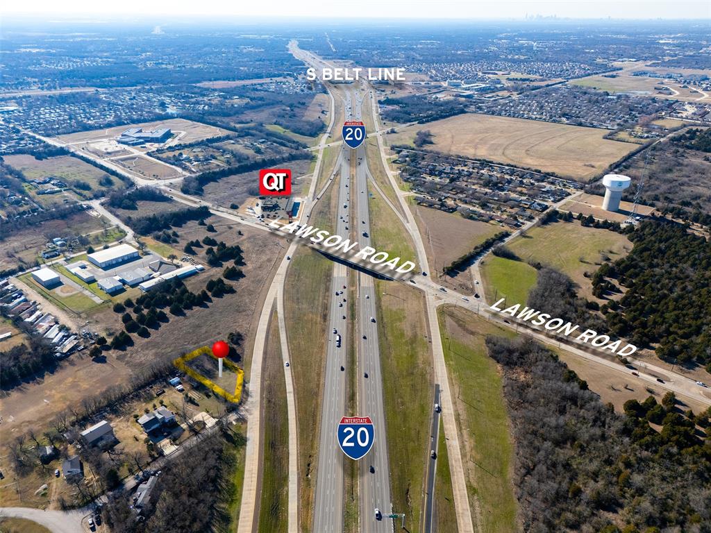 Position your business for success with this high-visibility commercial opportunity at the busy intersection of Interstate 20 and Lawson Road in Mesquite. Boasting approximately 95 feet of prime frontage along the I-20 service road, this nearly half-acre parcel offers exceptional exposure to steady highway traffic—an ideal setting for businesses that depend on being seen. Zoned for commercial use, the property presents a wide range of possibilities, from retail and service-based operations to investment or development opportunities. With strong accessibility and a strategic location in a growing corridor, this site is ready to bring your vision to life. Opportunities with this level of visibility are rare—secure your showing today and explore the potential firsthand.