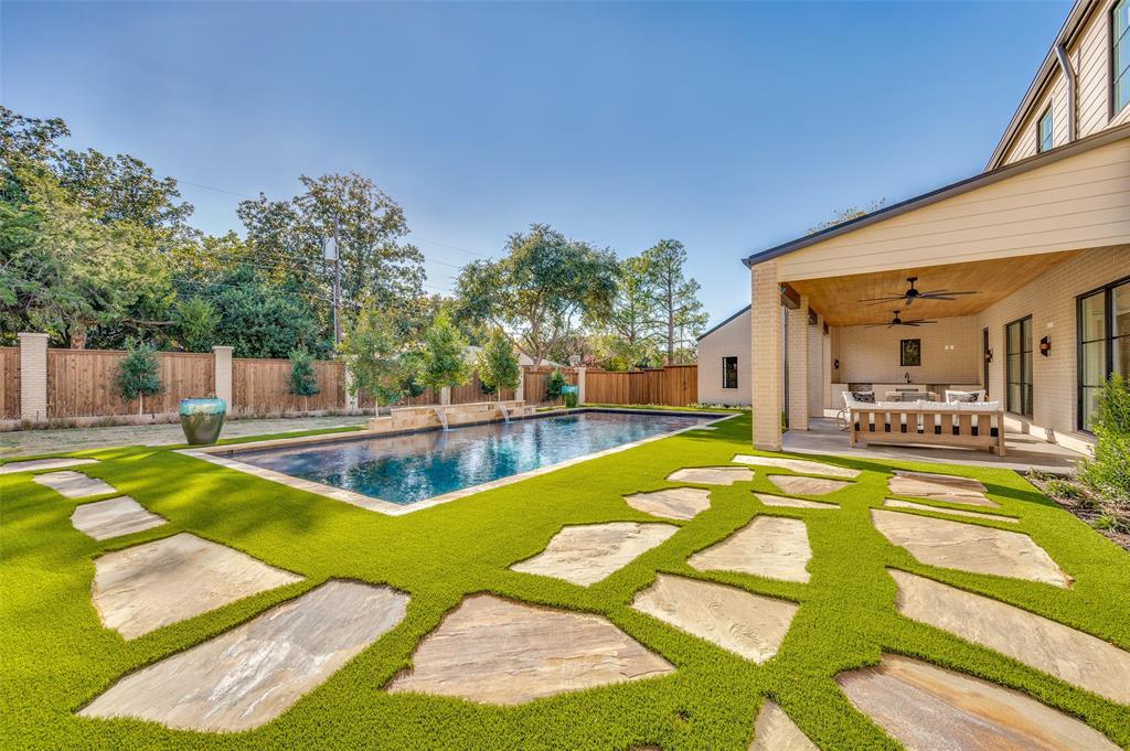 A custom designed new construction home in the heart of the Disney Streets and private schools. A dynamic long L shaped design made for the owners to view greenery, water & calm elements throughout the property with southern exposed light across the backyard walls. Expansive glass throughout the home with views to the outdoor elements will have the stress levels drop instantly. The outdoor area is complete with a jumbo sized pool and outdoor living plus a golf practice area. Inside the warm design elements include natural materials limestones, white oak, handmade tiles, white plaster, cast stones, smooth walls, high ceilings and clean lines all set within a warm and open layout. Comfort lighting compliments the tones and highlights the expansive art walls.  Floorplan offers 4 bedrooms all with private baths, the master wing is a must see, flex room, pet wash station and powder bath, multiple living spaces, expansive kitchen, large game room, golf practice area and a 3 car garage