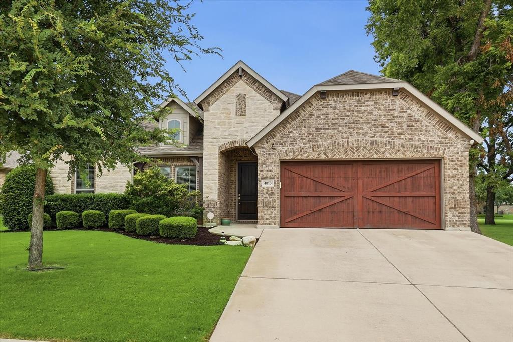 LOCATION LOCATION LOCATION! Built for the buyer who values convenience as much as space, this John Houston home combines an open everyday layout with one of Midlothian’s most practical locations. Positioned next to the neighborhood park and playground and a 2-minute walk to Heritage High School, daily routines become simpler without giving up neighborhood feel. Inside, engineered hardwood flooring anchors the main living space while natural light carries through the open design. The kitchen was built to function and gather around, featuring granite countertops, a large island, knotty alder cabinetry, stainless steel appliances, built-in oven, modern backsplash, cabinet hardware, pendant lighting, and generous connection to the living and dining areas. The private primary suite offers a separate tile shower and soaking tub for a more relaxed end to the day. Additional improvements include surround gutters, replaced AC condenser, regular pest maintenance, and smart-home features. Outside, the covered patio and fenced backyard create flexible space for quiet evenings, pets, or entertaining. Residents enjoy neighborhood events, seasonal décor, trails, park amenities, and convenient access to nearby shopping including the new Tom Thumb and Midlothian’s expanding recreation offerings.