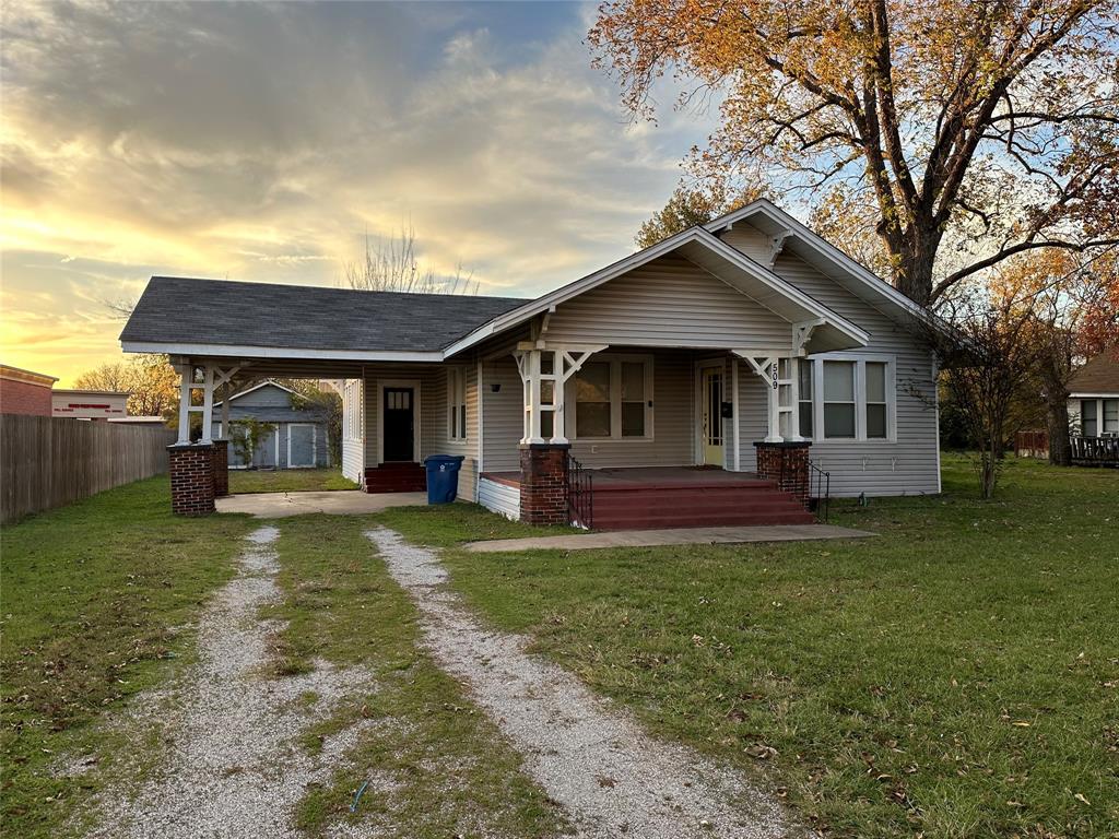 Residential or Commercial Property located just off Hwy 84 in Mexia. The home is currently being used as an investment property leased thru July 2026 at 1350 per month. The home is Craftsman style and has a lot of character. It has original hardwood floors with an extra large living room that has a cozy electric fireplace as the focal point and glass french doors leading into a formal dining room. There is an antique swinging door into the remodeled kitchen that is large enough for an island or eat in kitchen table. There are two pantries and a laundry room, three bedrooms, and two full baths one with a nice sized remodeled walk in shower and the other with a shower bath combo. Outside you will find a fenced in back yard, a storage building, and a large detached garage workshop. The home could use some TLC like releveling and a new roof and so it has been priced accordingly.