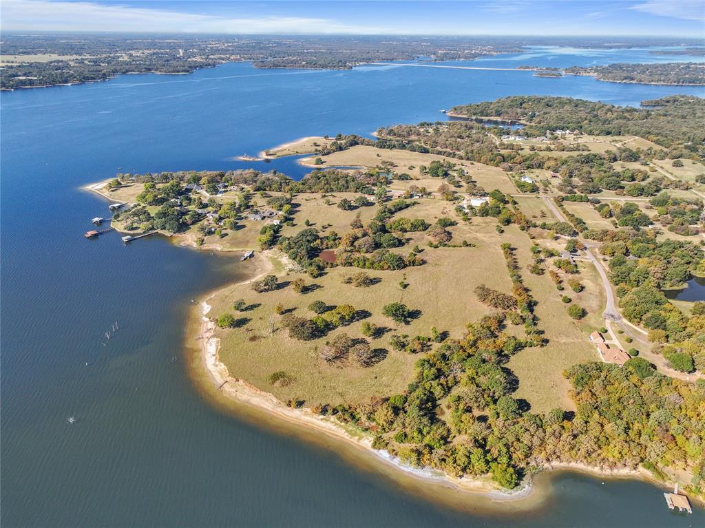Dream Big on Lake Fork – 24+ Ag Exempt Acres on the Point! Welcome to your blank canvas on the highly sought-after Lake Fork, a legendary bass fishing destination known nationwide for record-breaking catches and scenic East Texas charm. This rare 24.1-acre tract sits proudly on a point with stunning water views and endless possibilities. With 14.5 buildable acres and 9.6 leaseback acres from the Sabine River Authority, you can build docks, piers, or even lakefront structures right into the water. Whether you're envisioning your dream lakehouse retreat, a multi-home family compound, or a boutique waterfront development, this property can bring your vision to life. Ag-exempt and currently used for cattle grazing, it's the perfect blend of usability and investment potential. Unrestricted. Unmatched. Unlimited opportunity. Don’t miss your chance to own a one-of-a-kind slice of Lake Fork. Contact Brittanee Brown, listing agent for an opportunity to tour this slice of heaven!