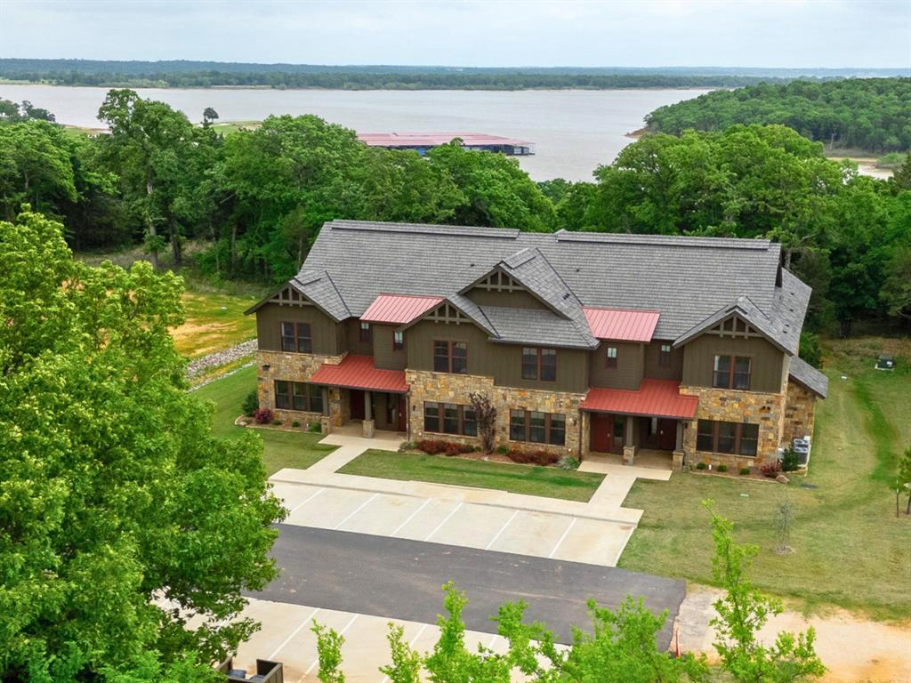 WATER-VIEW FURNISHED CONDO!!  Experience resort-style lake living in this new construction 4-bedroom waterfront condo in the exclusive gated community of Rock Creek Resort. Perfectly positioned near the shoreline with protected U.S. Army Corps of Engineers land bordering the lakefront, this property offers added privacy, preserved natural beauty, and peaceful water views.

Sold fully furnished, this turnkey condo is ready for immediate enjoyment as a full-time residence, weekend retreat, or investment opportunity. The spacious floor plan is designed for comfortable lake living with modern finishes, open-concept entertaining spaces, and easy access to outdoor recreation. A fully furnished bunk room provides the perfect space for kids, guests, or additional sleeping accommodations, making the condo ideal for hosting family and friends.

Enjoy an unmatched lifestyle with membership included to Rock Creek Resort, featuring an 18-hole Nicklaus Design championship golf course, marina, clubhouse restaurant, resort-style swimming pool, fitness center, and pickleball courts. Located just a one-minute walk from the marina and ship store, you’ll have quick access to boating, fishing, and all the amenities that make lake life exceptional.

Whether you’re looking for a luxury getaway or a low-maintenance waterfront escape, this fully furnished condo delivers the best of golf, boating, and resort living on beautiful Lake Texoma.