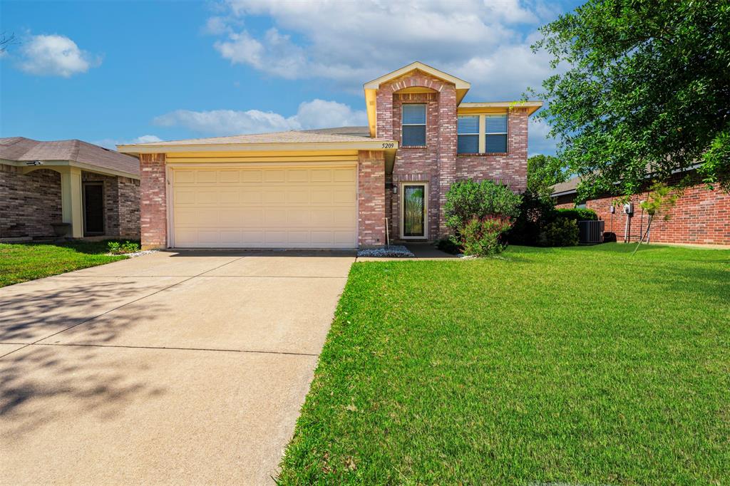 Welcome to your dream home at 5209 Prestwick Dr in Fort Worth, TX! This charming two-story, brick traditional home features 4 SPACIOUS bedrooms, 2.5 baths, and 2,528 square feet of warm, SUN- DRENCHED living space perfectly optimized for growing families. Nestled within the highly desirable Marine Creek Estates community, this INVITING property balances modern updates with a true sense of cozy neighborhood connection. The BRIGHT OPEN FLOOR PLAN seamlessly unites a cozy, brick-fireplaced family room, an elegant dining space, and a CHEF-FRIENDLY kitchen. A gourmet center island acts as the ULTIMATE GATHERING SPOT for casual morning breakfasts, holiday meal prepping, or casual evening entertainment, while the  Downstairs Primary Suite offers a spacious, PRIVATE SANCTUARY on the main level, complete with a GENEROUS walk-in closet and private bath. The FLEXIBLE UPPER LEVEL includes three additional roomy bedrooms, a full bath, and a SECONDARY LIVING AREA ideal for a game room or dedicated home office. TRUE FUNCTIONAL CONVENIENCES are complemented by a dedicated main-floor laundry room and an attached 2-car garage to keep your daily routines effortless. Step outside and a FENCED BACKYARD OASIS delivers a SECURE, private retreat featuring an outdoor storage shed and ample room for pets, gardening, or weekend barbecues. Accessibly positioned within short walking distance of PRISTINE RECREATIONAL TRAILS, parks, and LAKESIDE FUN near Marine Creek Lake, plus the neighborhood 's Resort-Style Neighborhood Perks grant community homeowners direct access to sparkling swimming POOLS, playgrounds, and sports courts. This PRIME Tarrant County Location is located close to highly rated local schools, PREMIER shopping, and dining destinations. Don’t miss this incredible opportunity to plant roots in an active, lifestyle-driven neighborhood! Plus, enjoy a NEW ROOF and Exterior Siding; installed June 2026.