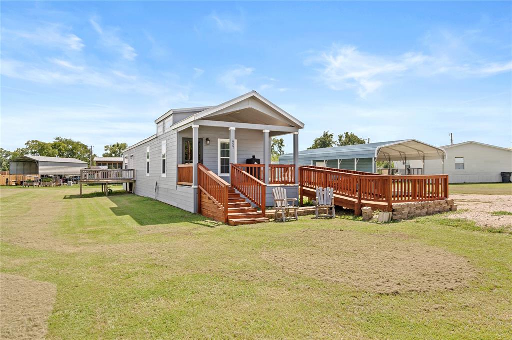 Charming Updated Home on 4 Lots in Holiday Village of Lake Fork. Discover the perfect blend of comfort, convenience, and outdoor living with this beautifully updated 2-bedroom, 1-bath home situated on nearly 0.8 acre in the gated Holiday Village of Lake Fork. Whether you're looking for a peaceful full-time residence or a weekend getaway, this property offers it all. Step inside to find fresh interior and exterior paint, new flooring throughout, and an updated 2025 HVAC system to keep you comfortable year-round. Enjoy your mornings on the front porch, or take advantage of the handicap-accessible ramp that makes this home welcoming to everyone. Outside, you'll love the spacious 2-car carport and the enclosed 15x22 workshop, perfect for storage, hobbies, or projects. With so much space, there’s plenty of room for outdoor activities, gardening, or expansion. Just a short walk from the clubhouse, you’ll have easy access to top-notch community amenities including a swimming pool, playground, and basketball court. For outdoor and fishing enthusiasts, the subdivision also offers a private boat ramp to world-famous Lake Fork.