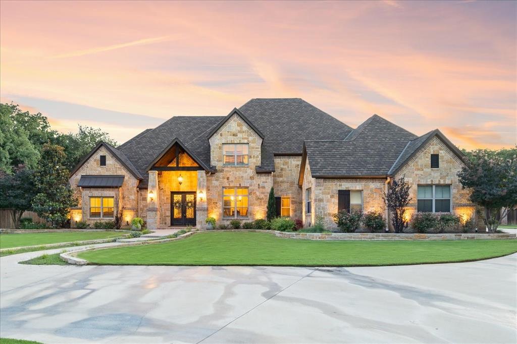 Custom-built luxury home showcases timeless craftsmanship and refined living in the desirable Timber Creek Estates in Stephenville, Texas. Double iron entry doors open to a light-filled interior with soaring ceilings, hand-scraped hardwood floors, custom trim, and beautiful views of the pool and backyard. With 4 bedrooms and 3.5 bathrooms, this home offers more than enough space to live or welcome guests. The primary suite is a peaceful retreat, featuring dual walk-in closets, separate vanities, travertine flooring, deep jetted tub, and a spa-inspired glass shower with dual showerheads. Two additional bedrooms share a bathroom with separate vanities, while the upstairs offers a private bedroom, full bath, living area, and a versatile landing with a door entry to reinforced attic storage. The large kitchen features 6 gas stove top burners, 3 ovens, built-in refrigerator, ice maker, granite surfaces, and opens to a breakfast nook overlooking the sparkling pool. A formal dining room and office - possible 5th bedroom - provide flexible spaces for entertaining and work. Outdoors, enjoy a resort-style backyard: chlorine pool with waterfalls, hot tub, outdoor kitchen, shower, bathroom, and fireplace which works as gas or wood-burning. The pool house offers central air and heat and its own water heater and septic – perfectly planned for a future separate living quarters. Set on 2 acres of fully irrigated Tiff Tuff Bermuda grass, the property is enclosed by a custom privacy fence; and features a 3HP variable-speed water well pump, highly-rated fiberglass asphalt luxury shingle, and outdoor sound system. From celebrating life's moments together to peaceful evenings by the fire or pool, this property blends elegance, comfort, and amenities for a one-of-kind place to call home. Construction completed in May 2016. Ask agent about the full amenities list, architectural plans, and foundation engineering plans.