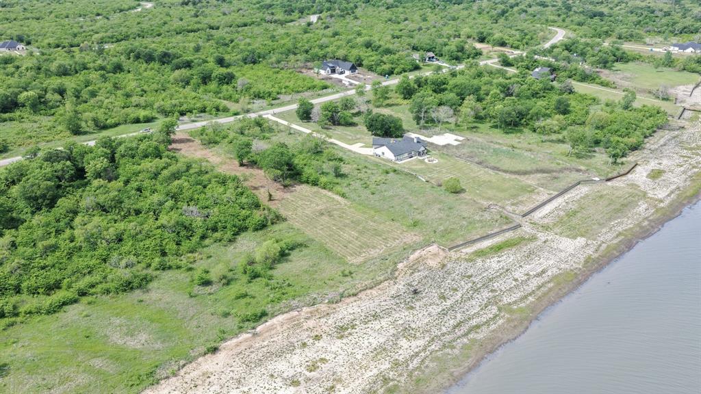 Stunning sunsets await on this expansive waterfront lot in the prestigious, gated community of Edgewater. Boasting over 100 feet of shoreline and just over an acre of prime real estate, this exceptional homesite offers the perfect canvas to build your dream lakefront retreat.

The lot has already been cleared, making it easy to envision your custom home positioned to capture breathtaking, unobstructed sunset views across the water. With ample space for outdoor living, entertaining, and privacy, this property truly stands out.

Located on sought-after Cedar Creek Lake, Edgewater offers an array of upscale amenities, including private boat slips, a lakeside pavilion with a fire pit, scenic hiking trails, and secure storage for boats and trailers. Enjoy the tranquility of lakeside living while still being close to local dining, shopping, and everyday conveniences.

With easy access to Highway 175, you’re just a short drive from Dallas—making this an ideal weekend escape or full-time residence. Cedar Creek Lake is known for excellent fishing, water recreation, and relaxed waterfront living.

Don’t miss this rare opportunity to own a premier waterfront lot in one of the area’s most desirable communities.