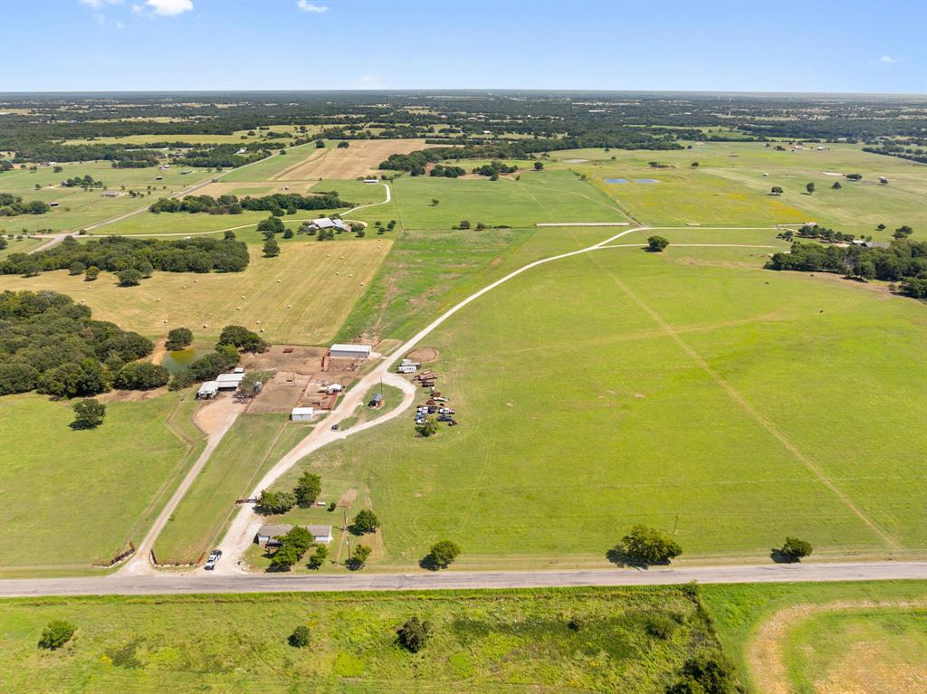 Cattlemen and Horsemen heads up. This almost 40 acre place offers an easy set up to run your cattle and horses . Great hay ground! An additional 10.5 acres is also available as well as surrounding lease ground can be negotiated  for more cattle or hay. Ideal if  you would like to build an indoor or a large home or both. Run a business and keep it separate with 2 gated fenced entry drives. Drive your cattle up from the back pasture to a covered squeeze chute, working pens and a  great barn with 5 stalls with runs. A western style 2 bedroom 2 bathroom  barndomium is turn key. There an older mobile home on the property which could easily be replaced or something else constructed with existing utilities. Or divide it and sell 12 acres up front.The 2 separate entries ready for gates have private driveways for two separate homesites and endless possibilities . The pasture is ready to graze. Ample shade trees, highly desired sandy loam with lush bermuda grass that can be hayed or pasture for livestock This property creates a true operating Agriculture property  Located in a quite rural area HORSE COUNTRY with easy access to Dallas Metro, Sherman or Gainesville the sky is the limit. It could also be easily  divided and still maintain ag status. Land like this with the ease of commute, proximity yet rural lifestyle,rooted in Texas agriculture lifestyle doesn't come along very often. Whitesboro offers a great lifestyle and all the amenities without the crowds of the larger surrounding cities. This small town lives big with dining, medical care, pharmacies, grocery store, shopping without traffic, crowds or a long drive. Yet the distance to surrounding areas offers you more without the hassle of living in lines and crowds, and if you want the Big City life you are less than an hour to all the Action of Dallas or Fort Worth. Start living your best Texas lifestyle now. Additional acreage available to lease or purchase Investment and development potential.
