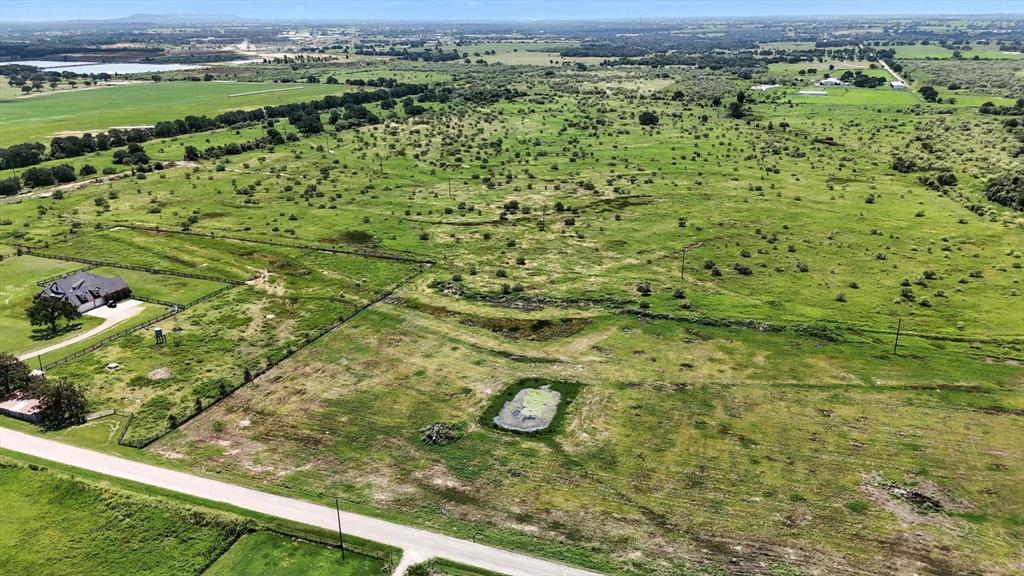 Welcome to Churchill Estates, a brand-new subdivision offering the perfect blend of peaceful country living and convenient access to nearby amenities. Located just 15 minutes from Granbury, this 2+ acre estate lot provides ample space to build your dream home, all while enjoying the serene sounds of the countryside without sacrificing proximity to shopping, dining, and entertainment. Nestled close to Lake Granbury and the charming Granbury Square, Churchill Estates offers the ideal retreat from city traffic with quick access to everything you need. This open, level lot boasts direct road frontage on Colony Road, with planned asphalt roads throughout the subdivision for easy access. Each homesite will require a private water well and septic system. Deed restrictions help protect your investment—available in the documents section or upon request from the listing agent. Photos depict the subdivision and are not lot-specific. Don’t miss your chance to be among the first to call Churchill Estates home!