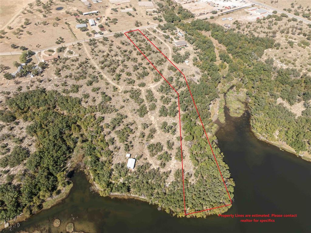 MOTIVATED SELLER  for Private Lake Waterfront Lot in Brownwood Texas in Clearlake Oaks estate.  This 3.25 acre lot is on a quiet and peaceful private lake with plenty of area for you to build or bring in your home.  This lot is like living in the country but with easy access to Brownwood Texas and all it has to offer.  This acreage lot has some oak trees, and some scrub brush that can be cleared for you to have a great building site.  This subdivision allows site built homes, barndo's,  mobile and modular homes, and RV's can be used as a temporary homes.  See the Declaration of Restrictive covenants for other information on property guidelines (via your realtor).  The electric and water are with coops.  Septic is  required for your sewer system.  Come see this great piece of property that is waiting for you to make your own little piece of Texas with waterfront ownership.