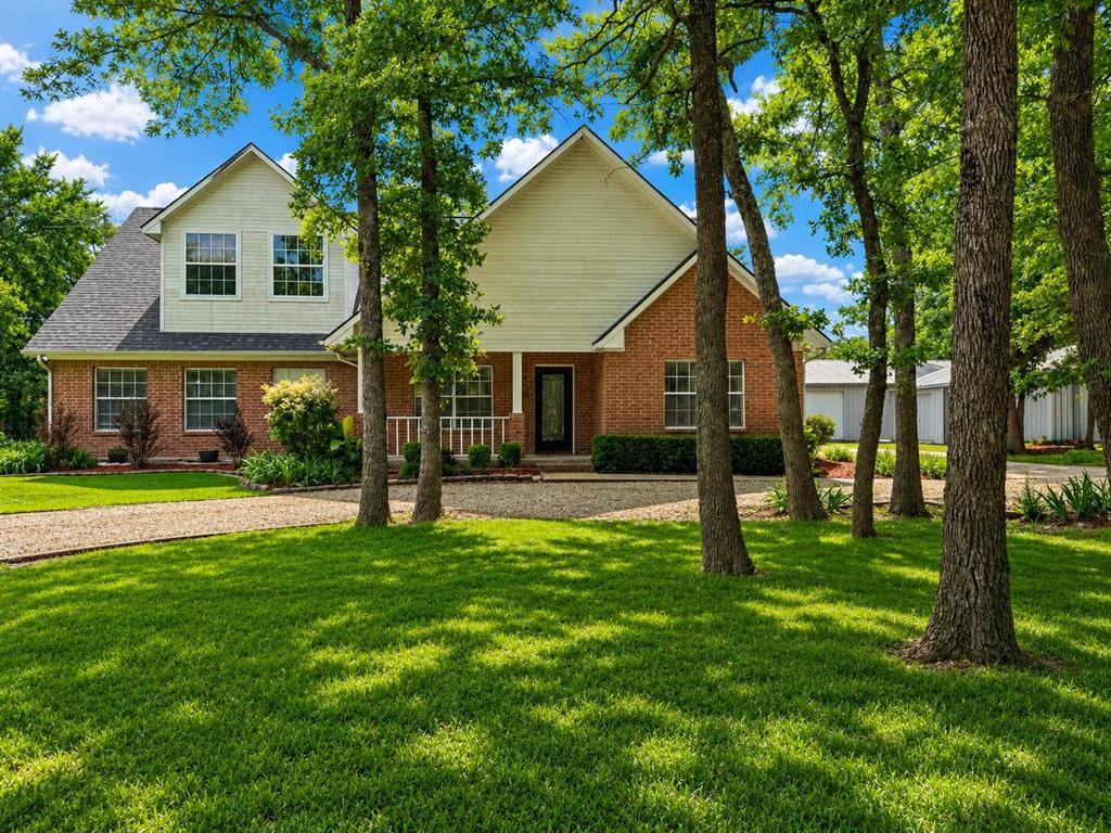 Price Improvement! Tucked away at the end of a quiet cul-de-sac, this private Greenville retreat offers space, sophistication, and room to live without compromise.
Set on 3 acres, this thoughtfully designed property blends everyday comfort with elevated functionality in a serene, tree-lined setting.

The 3,528-square-foot home features 4 bedrooms, 3 full baths, two living areas, and two dining spaces in an open, intuitive layout ideal for both daily living and entertaining. The main living room is anchored by a cozy wood-burning fireplace and flows seamlessly into the kitchen, dining area, and breakfast nook—creating an inviting space for gatherings of any size.

The kitchen offers both style and function with cherry wood cabinetry, under and over cabinet lighting, a new range, generous storage, and a pantry. All bedrooms are conveniently located on the first floor, including a spacious primary suite with a walk-in closet and an en-suite bath featuring dual shower heads. Each bedroom feels oversized, offering flexibility for guests, home offices, or multi-generational living.

Upstairs, enjoy a large family room and a dedicated media room complete with built-in speakers, a 90-inch screen with projector, theater seating, built-in microwave and refrigerator. All arcade games, pool table and media chairs convey, creating a fully turnkey entertainment space.

Outdoor living includes a covered back patio, extended patio with pergola, and a hot tub just three years old, all surrounded by mature trees for added privacy. Additional features include two detached garages totaling five spaces, a shop with a 220V plug, EV charging station, rain-barrel collection system, and an additional lot offering future flexibility to re-sell the additional lot or allow a friend or family member to come build next to you!

This rare end-of-cul-de-sac property delivers privacy, entertainment, and long-term potential in one exceptional Greenville offering. Bring all offers!