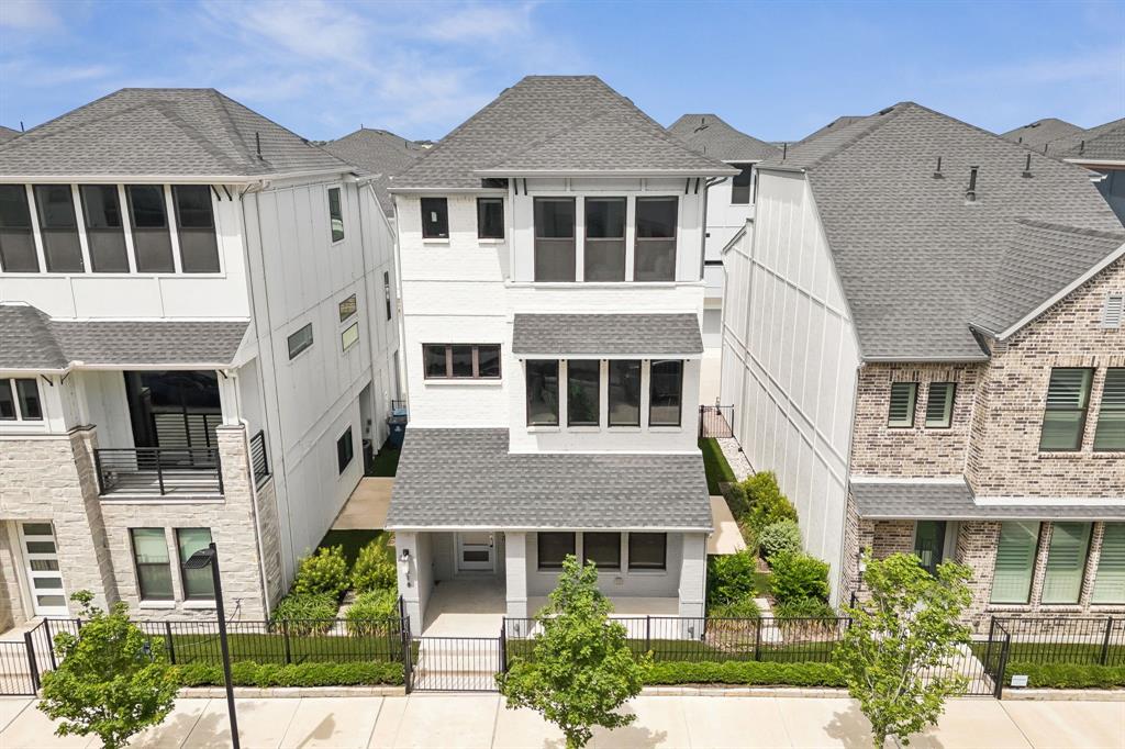 Modern Lake-Area Living Near Lake Ray Hubbard - Live steps from the shoreline in this 2022 K. Hovnanian row home-style residence in Rowlett’s Sapphire Bay area. Designed for low-maintenance living with a modern, vacation-inspired feel, this home offers a refreshing alternative to a traditional suburban layout. Clean architectural lines, a gated front porch, expansive windows, and a three-level design create a distinctive first impression. Inside, wide-plank flooring, high ceilings, and abundant natural light give the home an open, airy feel throughout. The main living level is made for gathering, with a spacious family room, dining area, and designer kitchen all connected for easy everyday living and entertaining. The kitchen brings style and function together with rich cabinetry, quartz countertops, stainless steel appliances, gas cooking, double ovens, a large center island, and generous storage. Whether you’re hosting friends before a night out, enjoying a quiet dinner at home, or prepping snacks after a sunset walk by the lake, this space is designed to work beautifully. The owner’s retreat offers a peaceful escape with bright windows, generous proportions, a large walk-in closet, and a well-appointed bath with dual vanities and a spacious walk-in shower. Secondary bedroom suites offer flexibility for guests, work-from-home needs, or extended stays, with comfortable layouts and modern finishes. The location is the lifestyle. Enjoy evening walks along the Lake Ray Hubbard shoreline, take in unforgettable sunsets over the water, explore nearby trails, rent a boat for the day at Sapphire Bay Marina, or fish from the shore. You’ll have quick access to I-30 for an easy connection to Dallas, Rockwall, dining, shopping, and recreation. If you’ve been looking for modern construction, lock-and-leave convenience, and a lake-area lifestyle without the upkeep of a traditional yard, this home deserves a closer look. Schedule your private showing today.