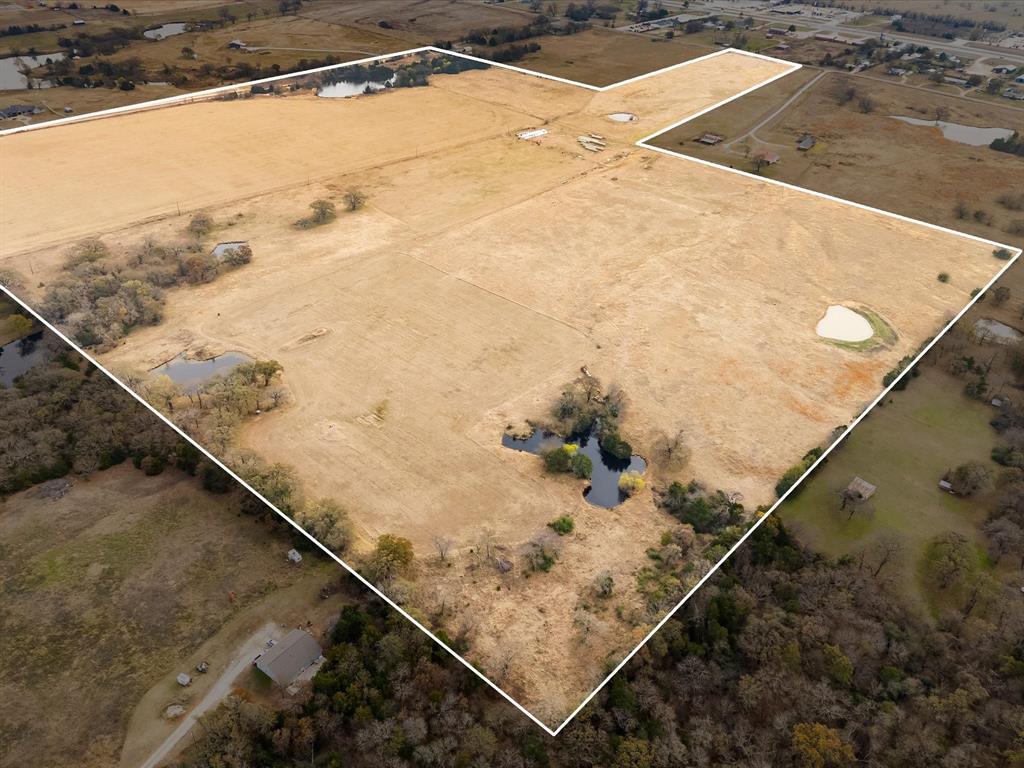 Farm, Build, or Invest – 88.2 Acres in a Prime North Texas Location! Welcome to Red Top Ranch, an exceptional 88.2-acre tract of unimproved agricultural land in scenic Whitesboro, Grayson County, offering endless potential for farming, building, recreation, or future investment. This irregularly shaped property features level to gently sloping topography and lies entirely within FEMA Zone X, outside the floodplain. Perimeter fencing includes a combination of welded pipe, grid wire, and traditional 5-strand barbed wire, making the property well-suited for immediate agricultural or ranch use. Several spring-fed stock tanks are scattered across the land, complemented by a picturesque 1.65-acre pond on the eastern edge of the property that enhances both functionality and natural beauty. In addition to its agricultural and development appeal, the open fields and water features make dove hunting an added bonus, offering recreational enjoyment alongside its investment potential. Whether you’re envisioning a private ranch, a productive farm, or a future residential development, Red Top Ranch delivers an ideal blend of rural tranquility and opportunity. With access off Sadler Road just minutes from Highway 82, the property provides convenient connectivity to Sherman, Gainesville, and Lake Texoma—perfect for peaceful country living with city amenities close at hand.