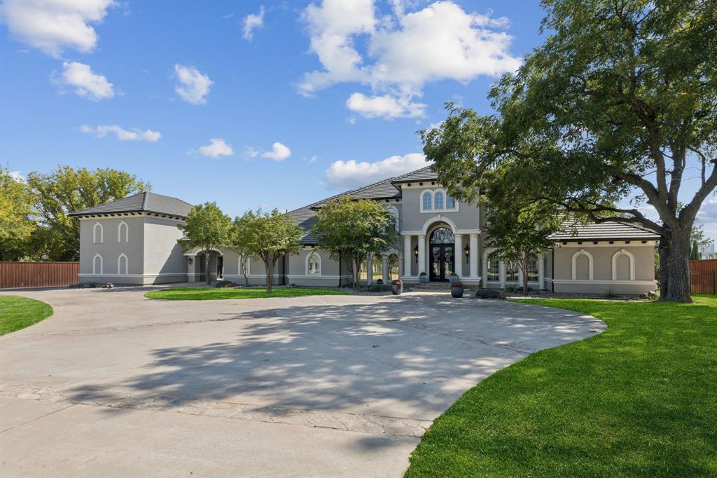 LOCATION, LOCATION, LOCATION! Welcome home to 351 S White Chapel, a private gated estate, located on Southlake's prestigious White Chapel Boulevard. This architectural masterpiece blends classic grandeur with exquisite craftsmanship featuring 6 bedrooms and 6.4 bathrooms. A grande double staircase with soaring ceilings welcomes you into this stunning estate. The curved staircases are adorned with custom wrought iron railings and travertine stone accented with black marble inlay. The formal living room showcases an expansive cast stone gas fireplace, coffered ceilings, and an abundance of natural light. The gourmet kitchen features a Sub-Zero refrigerator, Viking professional range and gorgeous custom cabinetry. The first floor includes a private study, media room, billiards room with full bar, a gym, indoor basketball court and private guest suite! A palatial primary bedroom boasts a cast stone fireplace, private sitting area, dry bar, spa-like ensuite, and custom walk-in closet with lighted built-in cabinetry! Take the elevator upstairs to find 4 bedrooms with ensuite baths and a large living area or gameroom. Outside, resort-style amenities await: negative-edge pool with cascading waters, fire pit, championship sports court, and covered terrace with stone fireplace and Viking outdoor kitchen. Experience the perfect blend of comfort, elegance and lifestyle conveniences. Welcome to your dream home! CISD.