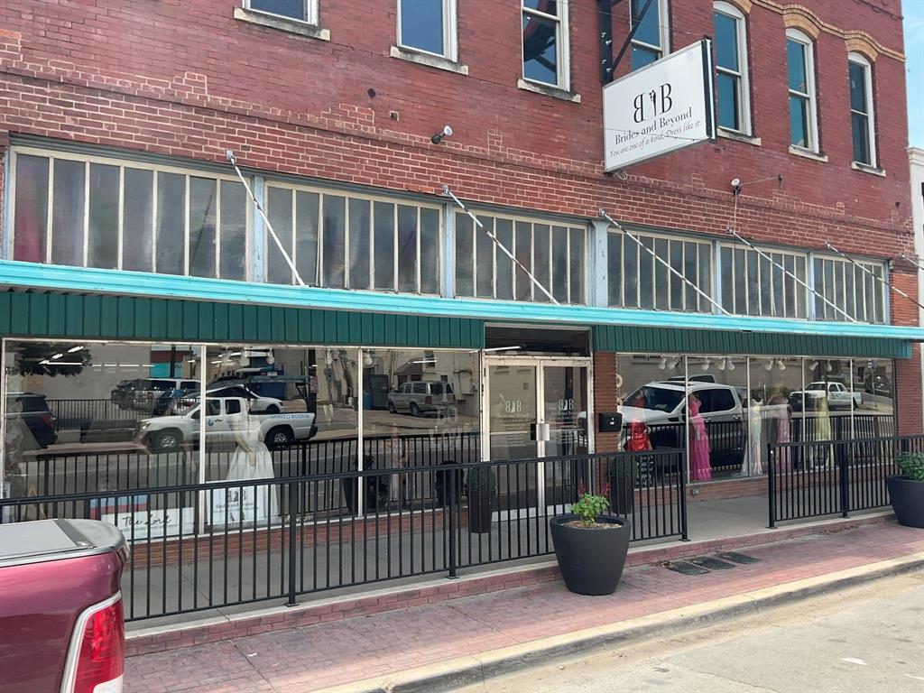 Prime multi-story commercial building located in a high-visibility area of Cleburne, featuring large front display windows ideal for retail, restaurant, or mixed-use.  The main level offers a functional layout with three dressing rooms, two restrooms, a large bar area, a private office, and a dedicated storage space—well-suited for high-traffic operations. A wide staircase leads to the second floor, providing additional flexible space for retail, office, or event use.  The third level, currently not air-conditioned, presents excellent conversion potential for residential, studio, or additional income-producing space. A portion is already configured with a bedroom, kitchen, and two bathrooms. With two active floors and a third offering expansion potential, this property is ideal for both owner-users and investors. Currently leased under a five-year term at $3,500 per month, providing immediate income.  

A rare opportunity to establish or invest in a high-exposure commercial property with long-term upside.