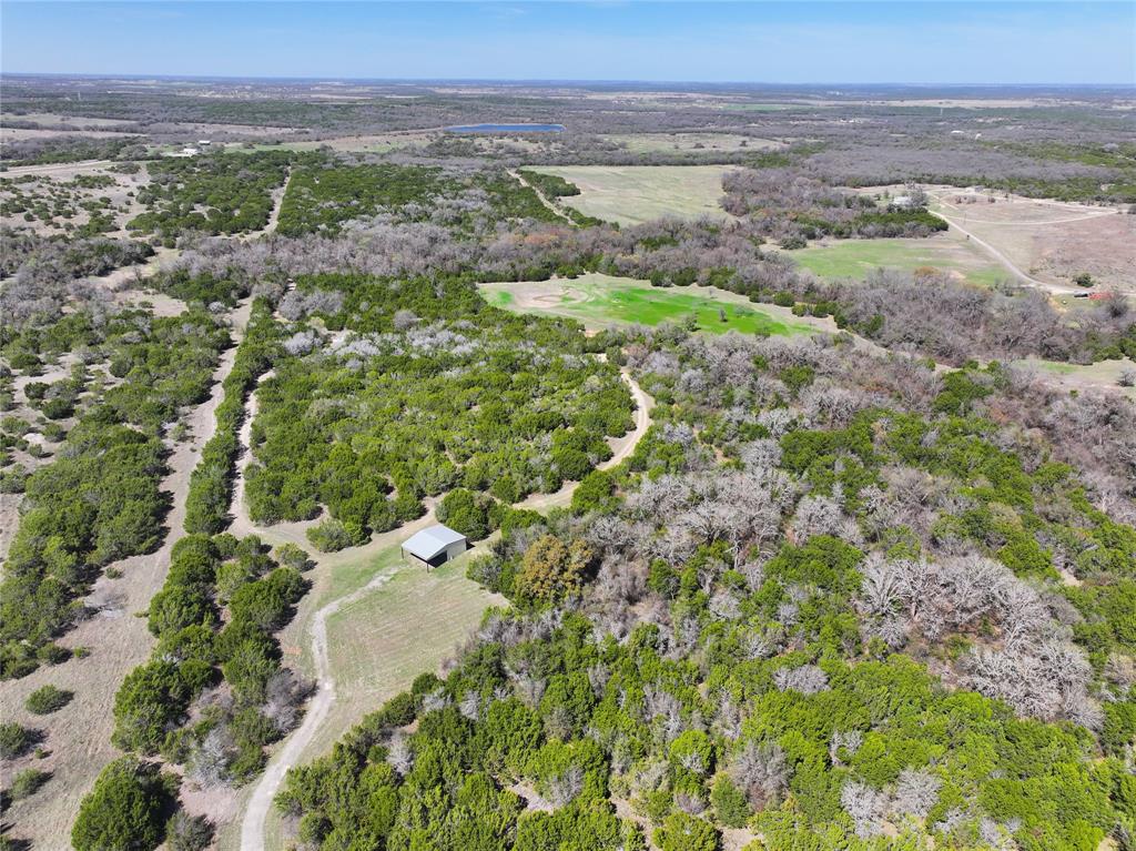 Hunters, Outdoors men and women, nature lovers, come see this undeveloped, unspoiled 30 acres in Erath County. Currently with a wildlife exemption and filled with wildlife, the seller has spotted deer, wild hogs, and wild turkeys. This is where you go to get away from it all. There is a small camp house on the property with power (no water) a great place to stow your gear and spend the night if you are out roughing it for the weekend. Exceptional location feels isolated and private, just is just 17 minutes to shopping, dining, schools or medical in Stephenville. What a great place to build your dream home.  No City Taxes, No Restrictions, No HOA...The drawing and lot sizes shown are approximate and are a proposed division of the total 78 acres also for sale, see MLS21199607 , a new survey will be required to determine exact measurements and lot lines. Property is behind a locked gate, 24-hour showing notice required to walk or drive on property.
