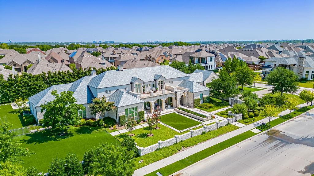 Unbeatable Value! This meticulously crafted estate in the prestigious Viridian Community redefines luxury. Built to the highest standards, it offers 5 bedrooms, 5.3 baths, and an elevator, all on a sprawling acre lot. Timeless elegance meets modern craftsmanship, with natural light pouring through grand windows, accentuating custom wood beams and hardwood floors. The gourmet kitchen boasts professional-grade appliances, a stunning wood-top island, and ample counter space. Each of the 4 secondary bedrooms features ensuite baths, while the primary suite is an unparalleled retreat. The elevator connects to a second level with two additional bedrooms, expansive storage, and a cedar closet. The screened-in back porch seamlessly extends to the fully turfed, low-maintenance backyard, complete with a serene spa and water feature. This home is a masterpiece of design and function, offering an extraordinary living experience at an unbelievable price.