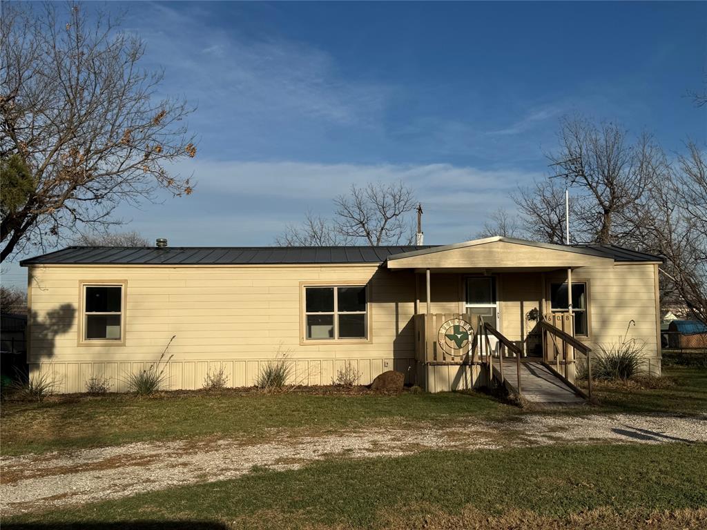 This stylishly updated 2-bed, 2-bath manufactured home features Hardie board siding, an open-concept interior, and modern bathrooms.  Nestled on a large lot, it includes a rear entry double carport and a versatile workshop. All appliances remain, and it's conveniently located close to the elementary school. Move-in ready—ideal for downsizing or a fresh start!