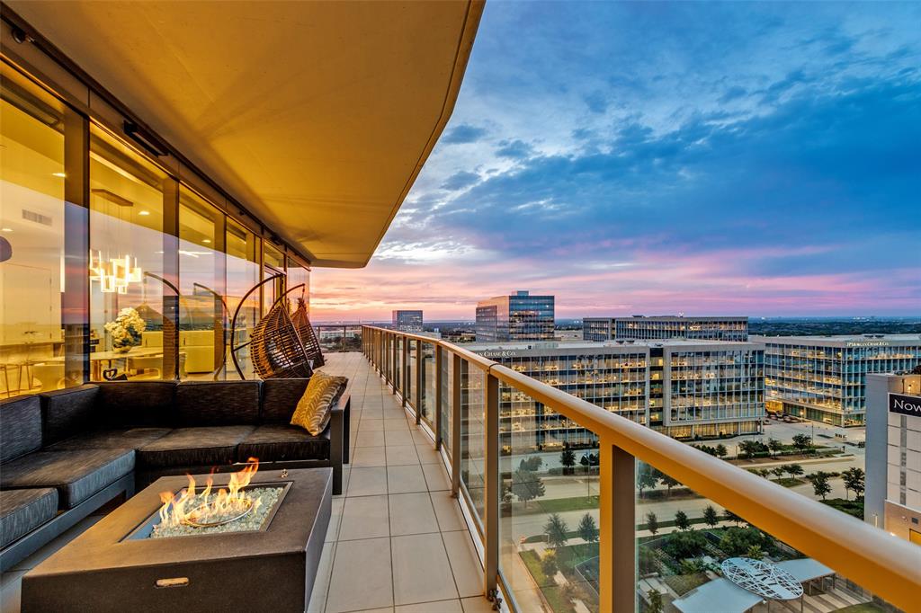 OPEN HOUSE ~ SATURDAY JUNE 13th 11 - 2 PM ~ Premier North-West corner unit on the 11th floor of Windrose Tower—offering panoramic sunset views, a wrap-around balcony with fireplace and true lock-and-leave luxury in the heart of Legacy West. This exceptional home features 2 bedrooms, 2.1 baths and a versatile den or office with floor-to-ceiling glass that fills the space with natural light and city vistas. The wrap-around terrace with fireplace creates a seamless indoor-outdoor living experience—ideal for entertaining or quiet evenings above the city. Inside wide-plank wood floors, refined architectural details and electronic shades deliver a warm, modern aesthetic throughout. The chef’s kitchen is both striking and functional showcasing quartz countertops, an oversized island, Sub-Zero refrigerator, Wolf 5-burner gas cooktop and a dramatic floor-to-ceiling glass wine case—perfect for hosting or everyday luxury living. The primary suite is a serene retreat with a custom-designed walk-in closet, elegant textured accent wall and a spa-inspired marble bath. The secondary bedroom provides flexibility with a built-in Murphy bed and custom closet, ideal for guests or additional living needs. A climate-controlled private storage unit is included, offering added convenience rarely available in high-rise living. Windrose Tower delivers unmatched service and amenities including 24-hour concierge, valet parking 7-days a week and 2 assigned parking spaces in a secure, enclosed garage. Residents enjoy resort-style living with a saltwater pool, private cabanas, state-of-the-art fitness-wellness center, golf simulator, wine lounge, conference rooms, outdoor kitchens, landscaped terraces, pet spa and 2 reservable guest suites. Positioned near the corporate headquarters of Toyota, Liberty Mutual and Chase and minutes from premier shopping, dining and entertainment this residence offers a rare opportunity to own a refined corner unit in one of Plano’s most prestigious addresses!