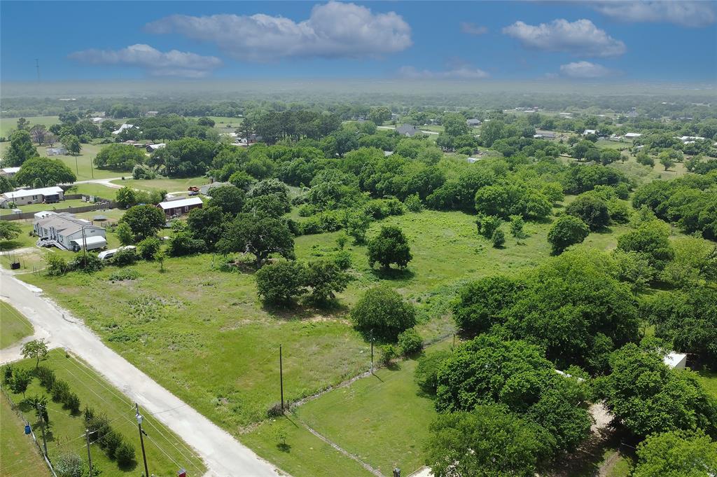 Discover the perfect balance of rural charm and modern possibilities! This exceptional property, nestled just outside the city limits, grants you the freedom of country living without sacrificing easy access to urban amenities. Spanning 2.83 acres, the lot has been thoughtfully cleared, ready to accommodate your vision—whether that's a custom home, a cozy homestead, or a multi-generational retreat. Towering mature trees create picturesque scenery and cool, shaded spaces, adding tranquility and natural beauty throughout the grounds. The property’s versatility is unmatched. You can design a spacious workshop, build a rustic barn, or welcome guests with a charming suite—tailoring every detail to your lifestyle and aspirations. Partially fenced, it’s ideal for animal lovers and hobby farmers, offering a peaceful, pastoral setting for any lifestyle. Enjoy the convenience of easy access to I-35W and Chisolm Trail Parkway, ensuring quick commutes and connectivity. Located in Joshua ISD, this property boasts no city taxes and sits in a USDA-eligible area, making it an attractive investment for those seeking a tranquil yet accessible country escape.