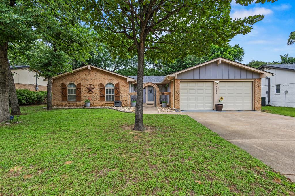 Adorable 3-bedroom, 2-bathroom home with a 2-car garage in an unbeatable location! Conveniently situated for an easy commute anywhere in the Metroplex, this charming home offers updated features throughout, including white kitchen cabinets, neutral paint colors, wood laminate flooring, and updated shower in 2023. The roof was replaced in 2024. Enjoy the beautifully landscaped yard and relax under mature shade trees on the open patio overlooking the spacious backyard. Located in the highly acclaimed Arlington ISD with zoning to Ditto Elementary, Young Junior High, and Martin High School. A wonderful opportunity to own a move-in ready home in a prime location!