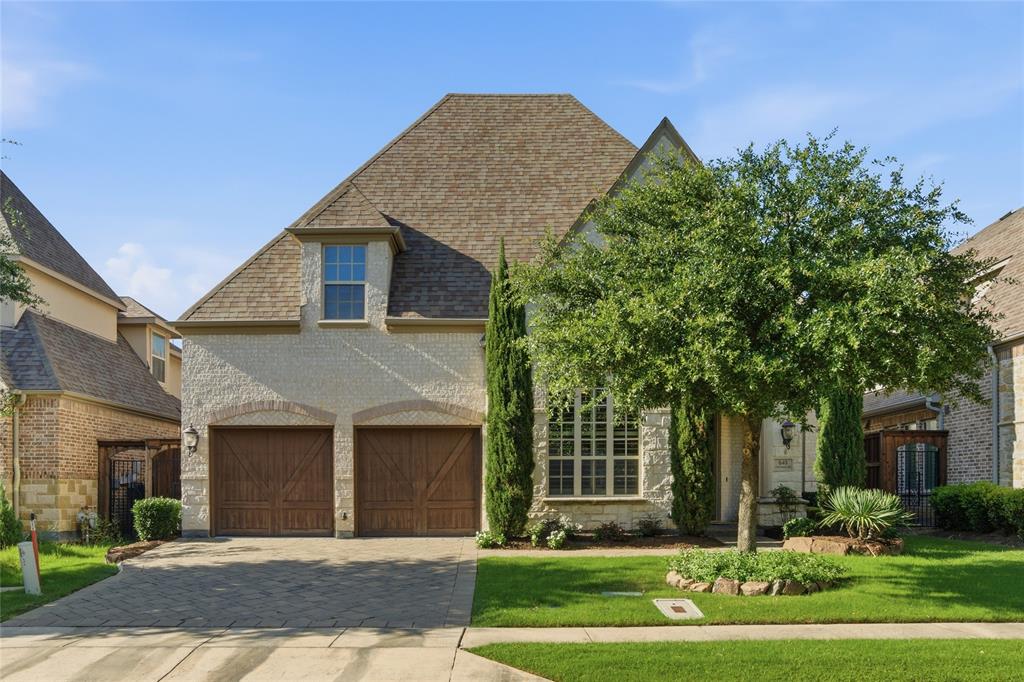 Exquisite Huntington Home in the prestigious gated and guarded community of The Lakes of Las Colinas, this Tudor-style residence blends timeless elegance with modern luxury. The home features hand-scraped hardwood floors, soaring cathedral ceilings with wood beams, plantation shutters, abundant natural light, and an open-concept layout ideal for entertaining and everyday living.

The gourmet kitchen offers an oversized island with seating, gas cooktop, double ovens, and ample cabinetry. The spacious living area flows seamlessly to a beautifully designed backyard retreat with a covered patio, built-in grill, firepit with seating, fountain, ambient lighting, and low-maintenance turf.

The primary suite includes a spa-like bath with a freestanding tub, walk-in shower, dual vanities, and a large walk-in closet with direct laundry access. A private office with custom built-ins adds functionality for remote work. Upstairs features a game room overlooking the living area and a dedicated media room, along with well-appointed secondary bedrooms including ensuite baths.

Additional highlights include epoxy garage floors, abundant storage, and an oversized garage. Residents enjoy access to Lake Carolyn, Campion Trails, and neighborhood amenities, all within minutes of Toyota Music Factory, major corporate campuses, shopping, dining, and with convenient access to DFW and Love Field airports and major highways.