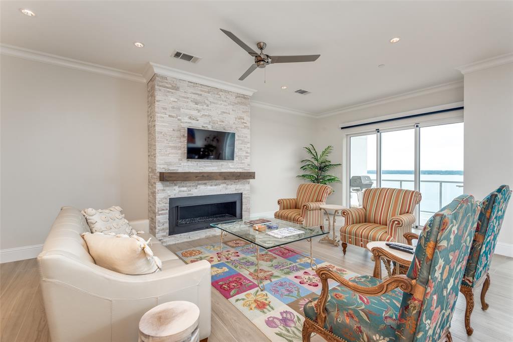 Minutes from DFW, this 7th-floor condo at the Lakeside Tower gives picturesque views of Lake Grapevine both from its generous balcony and from almost any room in the home.  Truly lock & leave, the 2bd, 2ba condo is accessed directly and securely by a private elevator.  Upgrades to the unit include a custom private office, built-in icemaker, wine chiller, and Wolf and Sub-Zero appliances - including but not limited to a six burner gas range and side by side fridge. Unit comes with two on-site storage units and two assigned garage spaces.  Residing at the tower offers pampered lake living with an on-site spa, concierge services, valet, resort-style pool, full gym, putting green, golf simulator, theater room, and outdoor dining with firepit.
