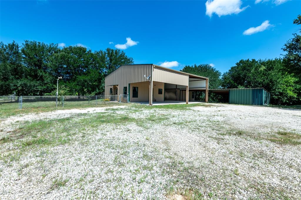 A beautiful tree-lined driveway leads you to this versatile dual-apartment property, ideally located just minutes from Hico and only 20 minutes from Stephenville. Together, the two apartments offer 1,320 sq ft of combined living space, thoughtfully separated by a covered parking area that enhances privacy and functionality. Each unit provides comfortable living areas suited for multi-generational living, rental income, guest quarters, or even a dedicated home office. This home comes equipped with a solar energy system that significantly reduces monthly utility costs while providing clean, renewable power year-round. The panels are seamlessly installed on the roofline, preserving the home’s aesthetic while maximizing sunlight exposure.

An upstairs workshop adds another layer of flexibility, giving you a quiet, elevated space perfect for crafting, woodworking, or any hands-on projects you want to keep organized and out of the main living areas. Two additional storage buildings offer ample room for tools, equipment, and seasonal items, keeping the property tidy and efficient. The property also offers separate covered parking for additional shelter from the elements.  The peaceful setting, mature trees, and easy access to nearby towns make this a rare find in today’s market—equally appealing as an investment opportunity or a serene retreat close to town.

A rare multi-use opportunity in the heart of Central Texas. This versatile property offers the freedom to operate as commercial space, income-producing investment, or a comfortable residential home—all on one well-located site. With quick, convenient access to Hico, Dublin, and Stephenville, the location supports business visibility, commuter ease, and long-term value. Whether you’re looking to launch a storefront, establish an office, create rental income, or settle into a private homestead, this property delivers the flexibility to bring your plans to life.
