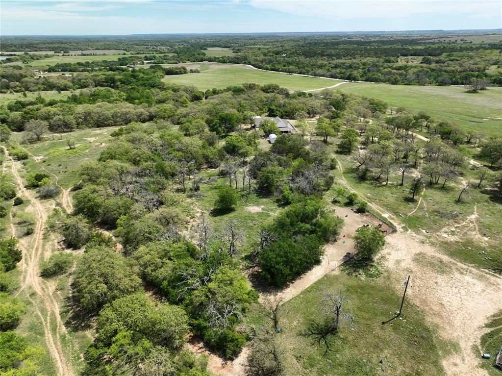 Beautiful and secluded is the best way to describe this place. Home sits back over looking a valley of Lush coastal and lots of post oak trees while the back is very treed with lots of wildlife. Come enjoy the country and see what all this place is made of.