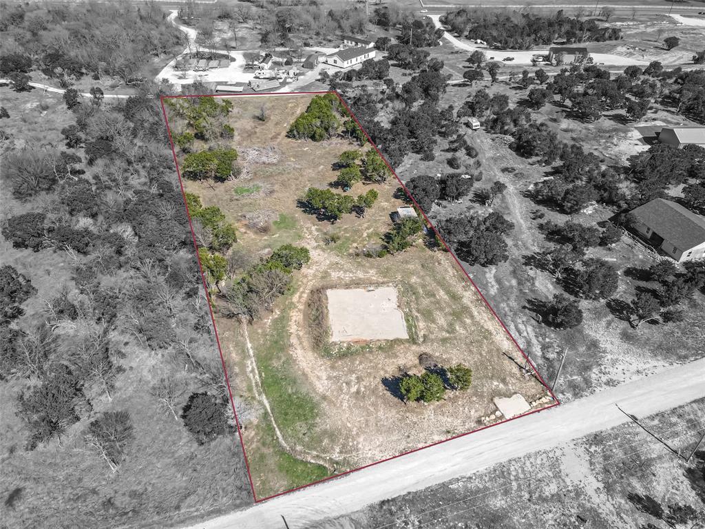 LOCATION! LOCATION! Don't miss this great opportunity to own this large lot!  Nestled outside city limits. It is the perfect size and is ready for your ideas! Drive by and take a look today...this one won't last long! Discover the perfect canvas for your dream home on this spacious lot of over 2 ACRES, located in the Glen Rose School District. It comes with a 50x50 foundation with plumbing already installed! This property offers you the peace and privacy you desire, while being surrounded by beautiful trees. Water is available. Electric is ready for meter hook up and will need a septic tank. A great chance to design the home you've always wanted. Don't miss out on this exceptional property! Call or text today!