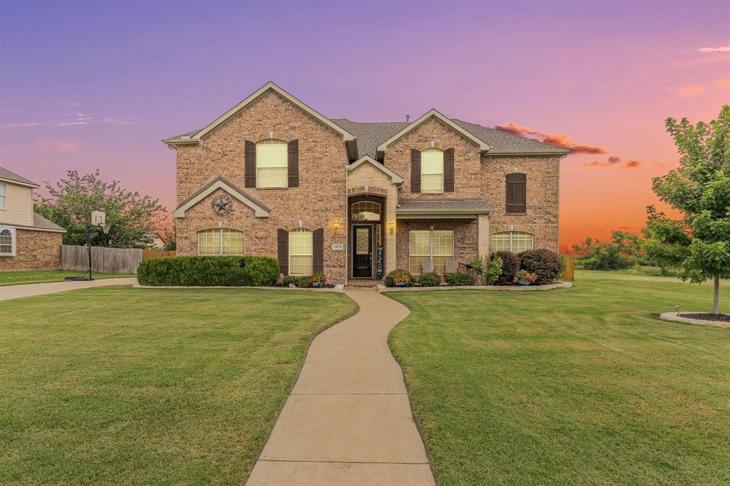 CHARMING CURB APPEAL IS JUST THE BEGINNING! This beautifully maintained home is situated on a premium nearly half-acre lot directly next to a peaceful greenbelt in the highly sought-after Northwest ISD. Designed for both everyday living and entertaining!
This spacious home offers an ideal floor plan with the primary suite, office, formal living area, formal dining room, breakfast nook, and main living spaces conveniently located downstairs. The inviting living room showcases a stunning floor-to-ceiling stone gas fireplace for a cozy ambiance, while the kitchen features granite countertops, stainless steel appliances, double ovens, a center island, breakfast bar, and abundant cabinetry. Elegant architectural details including crown molding, decorative trim work, and recessed ceilings add character and sophistication throughout the home.
The primary suite offers a spacious retreat with private access to patio, a large walk-in closet, dual vanities, garden tub, and separate shower. Upstairs, you’ll find all secondary bedrooms along with a large game room and dedicated media room, creating the perfect space for family fun while maintaining privacy for the main living areas below. Car enthusiasts and hobbyists will appreciate the versatile 4 car garage setup, offering 2 car attached and separate 2 car with exterior access.
Step outside to your backyard oasis to enjoy beautiful Texas sunsets featuring a heated saltwater pool with spa and water features, covered patio, and expansive greenbelt views!
Major updates include a new roof in 2025, downstairs HVAC replaced in 2026, a Generac whole-house generator, and a newer pool pump to name a few!
Residents enjoy exceptional amenities including a clubhouse, community pool, playgrounds, fishing pond & jogging and bike trails. The elementary school is conveniently located within the community. Prime location with close proximity to the Alliance Town Center, shopping, dining, and major highways for an easy commute!
