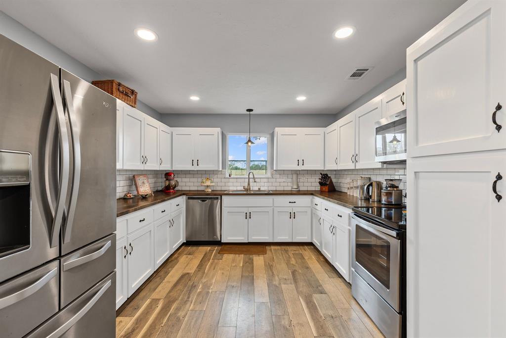 Welcome to the kind of home that makes you exhale and say, Ahhh, this is the life. Fully remodeled and radiating with modern charm, this delightful 3-bedroom, 3-bathroom country escape offers space, serenity, and a whisper of mischief. Inside, you'll find an open and inviting layout—including a converted garage that’s now bonus living space -because who actually parks in the garage anymore? Need to Zoom, daydream, or pay bills in peace? There's a just-right office nook nestled by the bedrooms to keep life organized... or at least look like it is. Step outside and prepare to swoon: a fully shaded yard, complete with a breezy swing set area that practically begs for lemonade and lazy afternoons. It’s giving porch-sittin’ energy, even if you’re standing. Have dreams of a mini-farm? You’re in luck. This property is fully fenced and ready for chickens, goats, or even that one horse your kids keep begging for. There’s even a spacious dog pen, because Fido deserves his own real estate too. Calling all tinkerers and tool-lovers: the workshop is ready for your next great DIY, dad project, or simply a place to hide with snacks. We won’t tell. And when you’re ready to trade country stillness for lake thrills, you’re just minutes from Lake Tawakoni and Lake Fork—fishing, boating, and weekend stories await. Don’t miss the fully covered car park, big enough for four vehicles—or a large party, should you decide to host one -BYO brisket. Oh, and the brand-new septic system? Just the cherry on top of this country sundae. Call today before someone else snatches up your slice of Texas paradise.  1% Lender credit if you use our preferred Lender.  Ask for details.