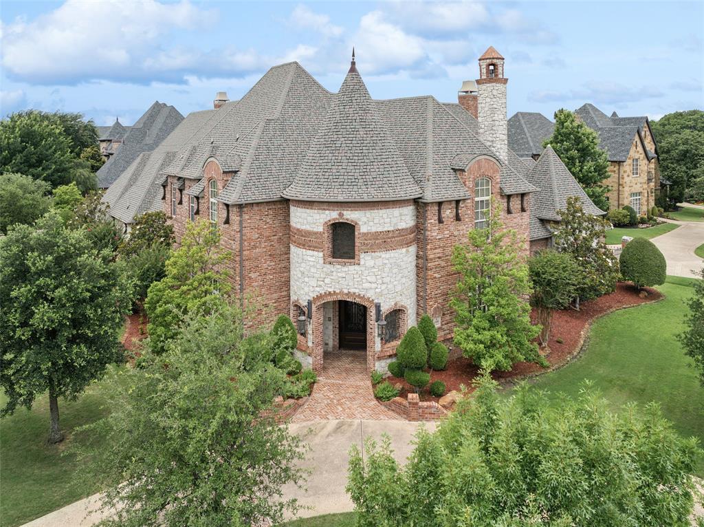 **FRESHLY PAINTED!** Welcome to this exquisite 6,123 SF residence in the gated Castleton Manor of Colleyville. This stunning property boasts a perfect blend of elegance and comfort, featuring an open floor plan that seamlessly connects spacious living areas with modern amenities. As you enter the home, you'll be greeted by high ceilings and abundant natural light, highlighting the beautiful hardwood floors. The gourmet kitchen is a chef's dream, equipped with top-of-the-line appliances, ample counter space, and generous islands perfect for both meal prep and casual dining. The adjoining breakfast nook offers a cozy spot to enjoy your meal while overlooking the lush backyard. The luxurious primary suite serves as a private retreat, with a sitting area around a stunning fireplace and a spa-like en-suite bathroom featuring a jetted tub, walk-in shower, dual vanities, and expansive closets. Additional downstairs amenities include a media room, guest suite, exercise room, executive office, and laundry room. Upstairs, a sprawling family room with a kitchenette and three generously sized bedrooms, each with access to well-appointed bathrooms, ensuring comfort for family and guests alike. Step outside to discover a spectacular outdoor space, ideal for entertaining or relaxing. The landscaped yard boasts a covered patio with a fireplace, an outdoor kitchen, and a sparkling pool and spa. Located in a prestigious neighborhood, this home is conveniently situated near top-rated schools, parks, shopping, and dining options. With its charming curb appeal and outstanding features, this residence is the perfect place to call home. Don't miss the opportunity to make this your own!