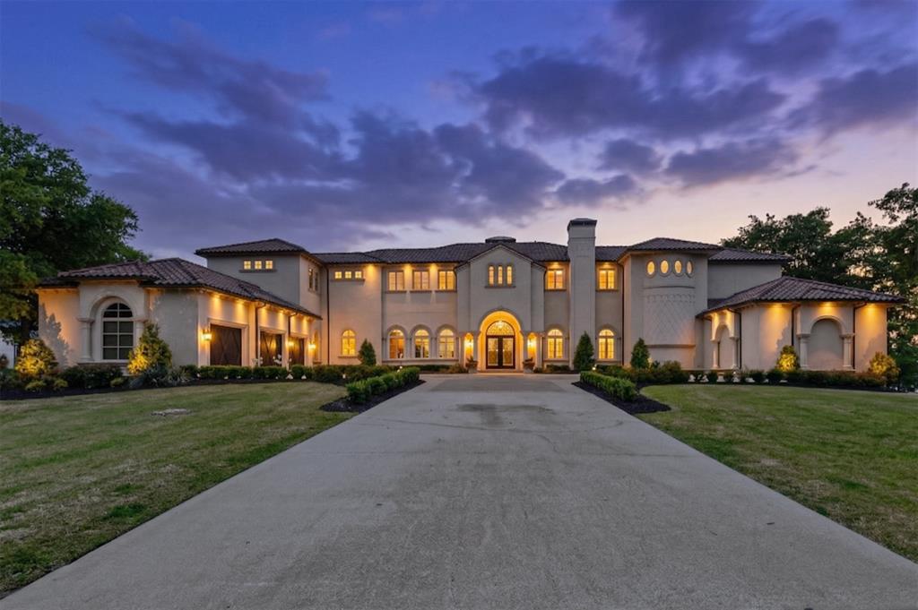 Imagine a life where every sunset belongs to you. Perched above the shimmering waters of Lake Texoma, this home is a masterwork of luxury and legacy. Built as the personal sanctuary of legendary builder & designer Mickey Munir, this nearly 8,000-sqft estate represents the pinnacle of his 50-year career. Set on 1.78 lakefront acres, it is a masterpiece crafted for those who believe living well is an art form. Morning begins on your 60-ft covered balcony as the lake breeze stirs. The day flows effortlessly from the chef’s kitchen - a true culinary arena featuring a 60” Wolf range, dual Sub-Zero refrigerators, and Miele dishwashers - to the sprawling 60-ft veranda. Whether you’re hosting a summer gala or an intimate family brunch, this home is a vessel for hospitality, designed to comfortably accommodate 18 guests, including a bespoke bunk room that becomes a kingdom for children. As evening nears, the sunken bar becomes the social heart of the home. Pour a vintage from the 150-bottle wine fridge and watch the sky turn gold through the walls of Jeld-Wen glass. For the ultimate escape, retreat to the private cinema. This isn’t just a media room; it’s a $250,000 sensory experience with California Audio Tech speakers, custom upholstered walls, and leather seating for 15. While the lifestyle offers one of pure relaxation, the engineering is one of pure peace of mind. You are protected by an 18-ft motorized privacy gate, a whole-home fire suppression system, and a 2026 security suite. The residence is a fortress of comfort, featuring five Lennox heat pumps, dual Navien tankless heaters, and a foundation anchored by 60 commercial-grade piers. Outside, a professional grilling station with its 42” Lynx Allsear grill beckons for weekend cookouts. Above the three-car garage, a finished, air-conditioned space offers a quiet retreat for a studio or gym. You aren't just buying a home - you are inheriting a master builder’s magnum opus, designed for a life lived without compromise.