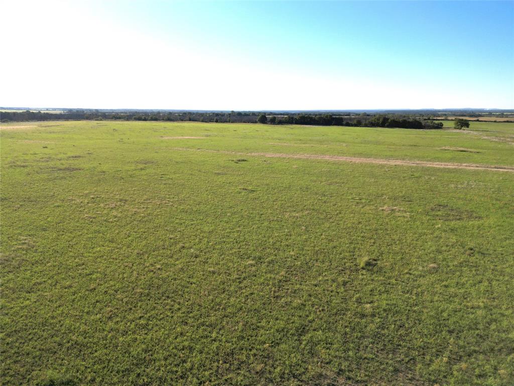 This 60+- acres to be surveyed out of a larger tract located just south of Eastland, TX, near Carbon.  Featuring approximately 30 acres of good coastal and the remainder in Post Oaks and a few Pecan trees.  The back portion has burned trees from the fire last year, but foliage has returned on many of the trees.  It is super thick and offers great habitat for wildlife.  There are 2 tanks on the property, one is dry and the other has a few feet of water in it.  Westbound Water runs along the County Rd, buyer to verify availablility of a meter.  Electricity also runs along the CR.  Good sandy to sandy-loam soil. A few nice places to build a home.  Come take a look!  Great location just 10 minutes from I-20.