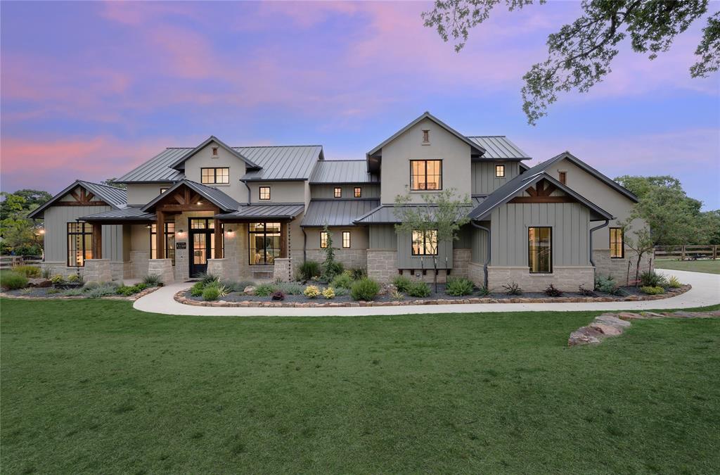 Gorgeous newer construction 5 bedroom, featuring open concept, indoor + outdoor living w modern transitional feel. Exposed natural beams throughout, transom windows allowing abundant natural light w 2 story main living space + floor to ceiling stone fireplace, light hardwoods and chauky white walls. The well equipped kitchen has extra lg quartz island, Thermador appilance pkg, extra storage + 14ft fabulous walk-in butler's + combined pantry. The lg downstairs main bedsuite showcases beamed catheral ceilings, spa bath + huge custom closet + bonus space perfect for exercise or 2nd office, all w views of the backyard. 2 en suites + additional family room are also on the main floor w 2 additional en suites up stairs. 4 large sliders open to the enormous covered patio, built-in grill + added remote screens. Fabulous yard ready for a personalized entertaining design. Class 4 seamless roof, foam encapsulated, energy efficient, instant hot water. All AV, cameras convey. No city taxes, no HOA.