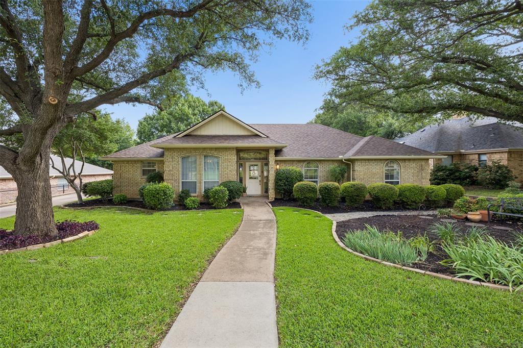 Single-story living in one of Trophy Club's most sought-after addresses. This four bedroom home is situated on a third of an acre with lush landscape and nice shade trees. This traditional home offers the ease of all-on-one-level living, tucked within the prestigious Northwest ISD and just moments from the renowned Trophy Club Country Club.
Inside, two living spaces , wet bar, dining room and four generously sized bedrooms provide room for family and guests alike, while the open, flowing layout invites both everyday comfort and effortless entertaining. Thoughtful traditional details lend warmth and character throughout. 
Step outside and discover your own private retreat. The sparkling pool takes center stage in the backyard, setting the scene for lazy summer afternoons, weekend gatherings, and golden Texas evenings under the open sky. Need more parking, this home has it with an extended driveway. Roof replaced in 2022, newer quartz counter top and a newer range. 
With golf, dining, and community amenities just around the corner, and the academic excellence of Northwest ISD right at your doorstep, 975 Trophy Club Drive isn't just a home — it's a lifestyle.