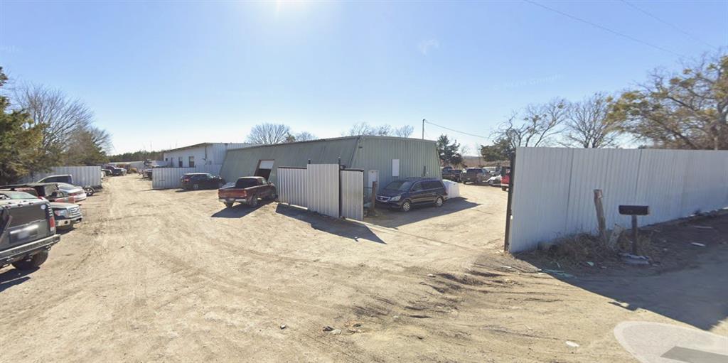 COMMERCIAL BUILDING of 5000 SQFT METAL in 5 ACRES with two bay 14x20 overhead doors that will hold Large Vehicles. with an office and bathroom  The property is currently used as a automobile parts. Property is sold as is.