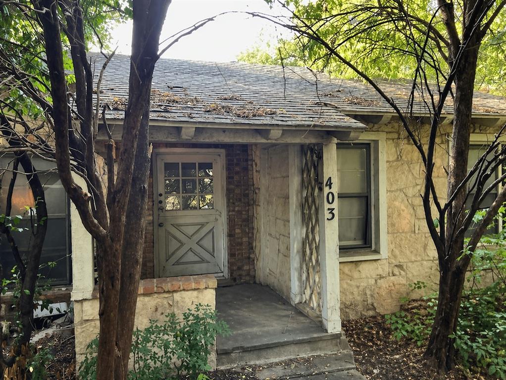 Investor opportunity at 403 N Tennant St located on a corner lot in a well established Dallas neighborhood with strong appreciation and resale comps nearby. This 3 bedroom, 2 bath home offers approximately 1,870 sq ft of living space on a 6,700 sq ft lot, providing a great layout for a full renovation or value-add project.

The property features hardwood flooring, a spacious living area, dedicated dining space, and a functional kitchen ready for updates. Additional highlights include a sunroom with wood-paneled ceilings and abundant natural light, a separate utility laundry area, and a detached structure with potential for storage, workshop, or conversion.

Exterior offers a private backyard patio area with mature trees and corner positioning that enhances accessibility and flexibility for future improvements. The lot size and placement provide strong curb appeal potential and added value compared to interior lots.

Home is being sold as is and will require updates, making it ideal for investors, flippers, or buy and hold strategies. Surrounded by renovated homes and rising values, this is a strong opportunity in a growing Dallas market.