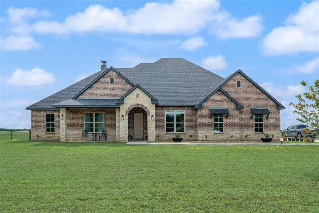 Stunning Custom Home on Expansive Acreage with Panoramic Views!!!

Experience the perfect blend of luxury, comfort, and wide-open space in this beautifully designed custom home situated on a spacious 2.5 acre lot!!
Featuring a striking brick and stone exterior, this meticulously maintained residence offers modern finishes, an open-concept layout, breathtaking countryside views in every direction. 
Step inside to discover a light-filled living area with soaring ceilings, a floor-to-cealing fireplace, and large windows that showcase the surrounding landscape. The gourmet kitchen is the heart of the home, complete with a large center island, quartz countertops, custom cabinetry, stainless steel appliances, and designer lighting ideal for both everyday living and entertaining.

The spacious primary suite serves as a private retreat, featuring tray ceilings, abundant natural light and a spa-inspired ensuite bath with dual vanities, a freestanding soaking tub, oversized walk-in shower and generous closet space. Additional bedrooms offer flexibility for family, guests, or a home office. A seperate bedroom with it's on ensuite bathroom could be ideal for a mother in law suite.

Outside, enjoy the covered back patio overlooking rolling green acreage and endless Texas skies. Whether you're hosting gatherings, enjoying quiet evenings, or simply taking in the peaceful surroundings, this property provides the privacy and space you've been searching for.

MUST SEE FOR BUYERS SEEKING LUXURY COUNTRY LIVING AT ITS FINEST!
