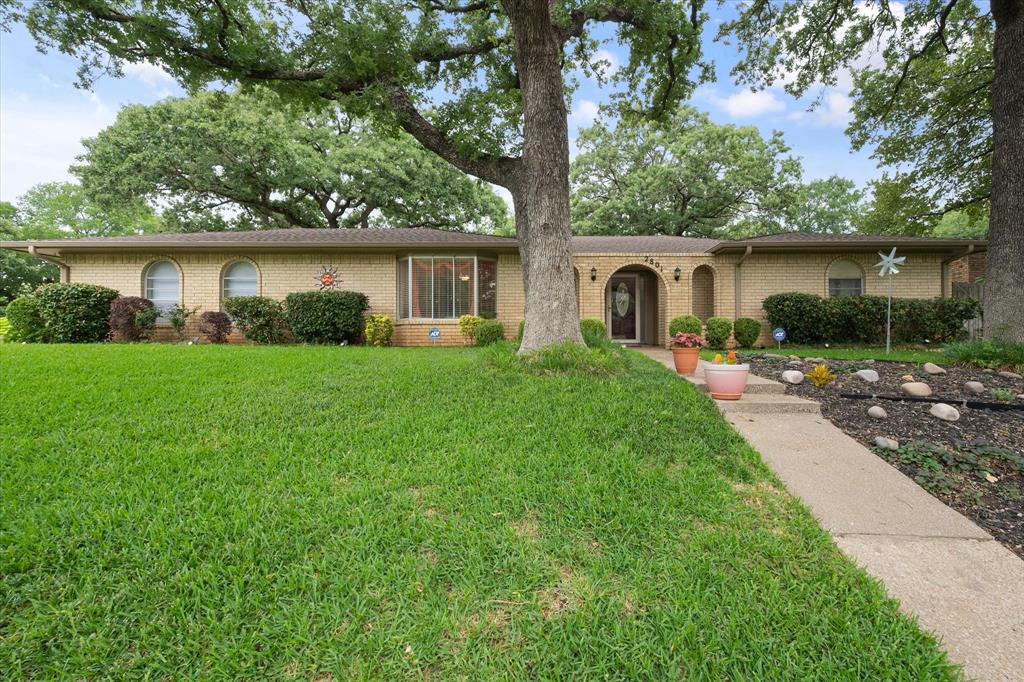 WELCOME HOME! Come see this beautiful home with a well-manicured lawn on an oversized corner lot, in the mature neighborhood of Valparaiso Estates.  Pride of ownership shows throughout this home. It was built in 1977, and you'll see some of the original quality designs and features. The entryway will lead you into an oversized sunken living room with a gorgeous fireplace. It's perfect for hosting family and friends.  It has a light and bright, cozy dining room that gets tons of natural light with large bay windows.  The dining room sits right off the kitchen, which has rich wood cabinets, granite countertops, and tumbled stone backsplash. The kitchen has lots of space for food prep and storage. This split floor plan allows for maximum privacy with the primary suite on the opposite side of the nicely sized secondary bedrooms.  The primary bedroom offers its own access to the three-season room overlooking the low-maintenance landscaped backyard. The primary ensuite bath features a separate shower, soaking tub, dual vanities, and two closets for ample storage. The secondary bedrooms are spacious as well, with a large secondary bathroom with custom furniture vanities that are sure to delight as conversational pieces.  Stop by and see what this home has to offer and more!