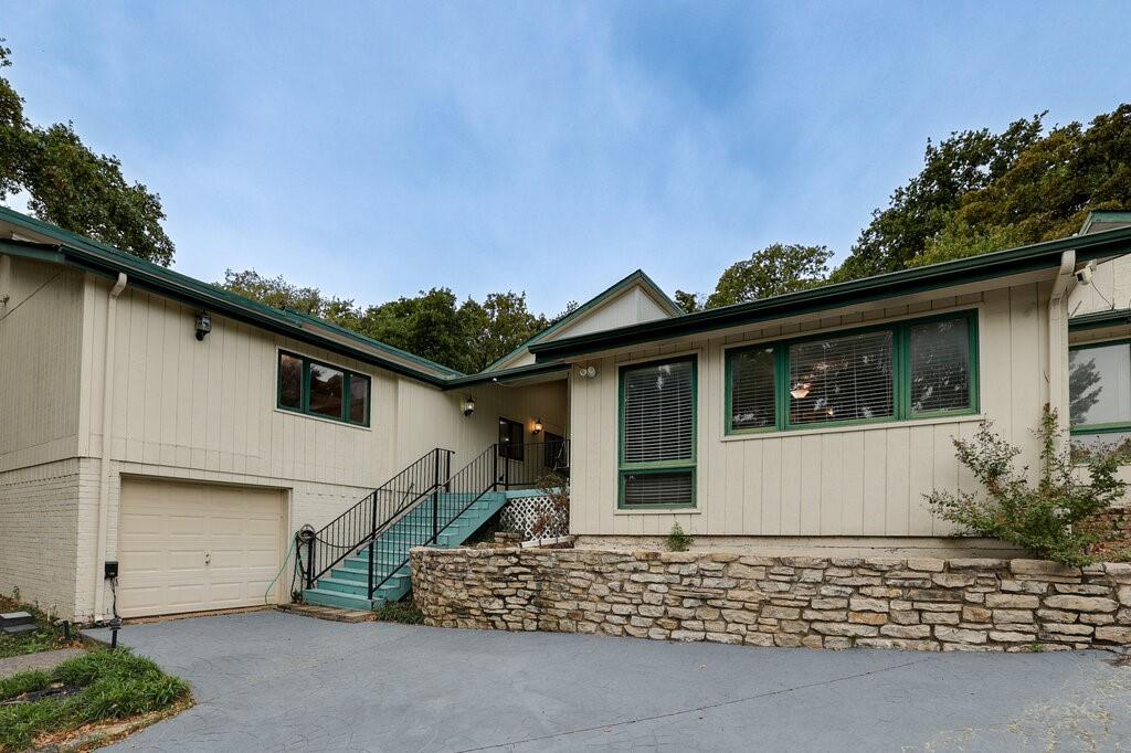 Unique home nestled on a quiet cul-de-sac; this 3,800+ sq. ft. multi-level home offers 6 bedrooms and 4 bathrooms with a flexible floor plan designed for everyday living and entertaining. According to a recent engineering report, the home requires 11 piers to stabilize the foundation. A freshly leveled and painted driveway creates a welcoming first impression, and a brand-new roof with 30-year shingles was installed in June 2026. Inside, the kitchen and breakfast area feature a sliding glass door leading to the backyard and swimming pool. A spacious formal dining room is ideal for entertaining, while the large living room showcases a floor-to-ceiling stone wood-burning fireplace, custom built-ins, and a spiral staircase leading to a private loft. The swimming pool was recently pressure-washed by a professional pool service and is ready for enjoyment. Neither the sellers nor the pool service company was able to locate the separate spa controls to test the spa. Additional features include a whole-house Generac generator with dual 80-gallon propane tanks and an attached 3-car garage. Conveniently located near the trails and recreation areas of River Legacy Parks, this vacant estate home is easy to show. All information is deemed reliable but not guaranteed. Buyer and Buyer's Agent to verify all information, including but not limited to schools, square footage, lot size, and taxes.